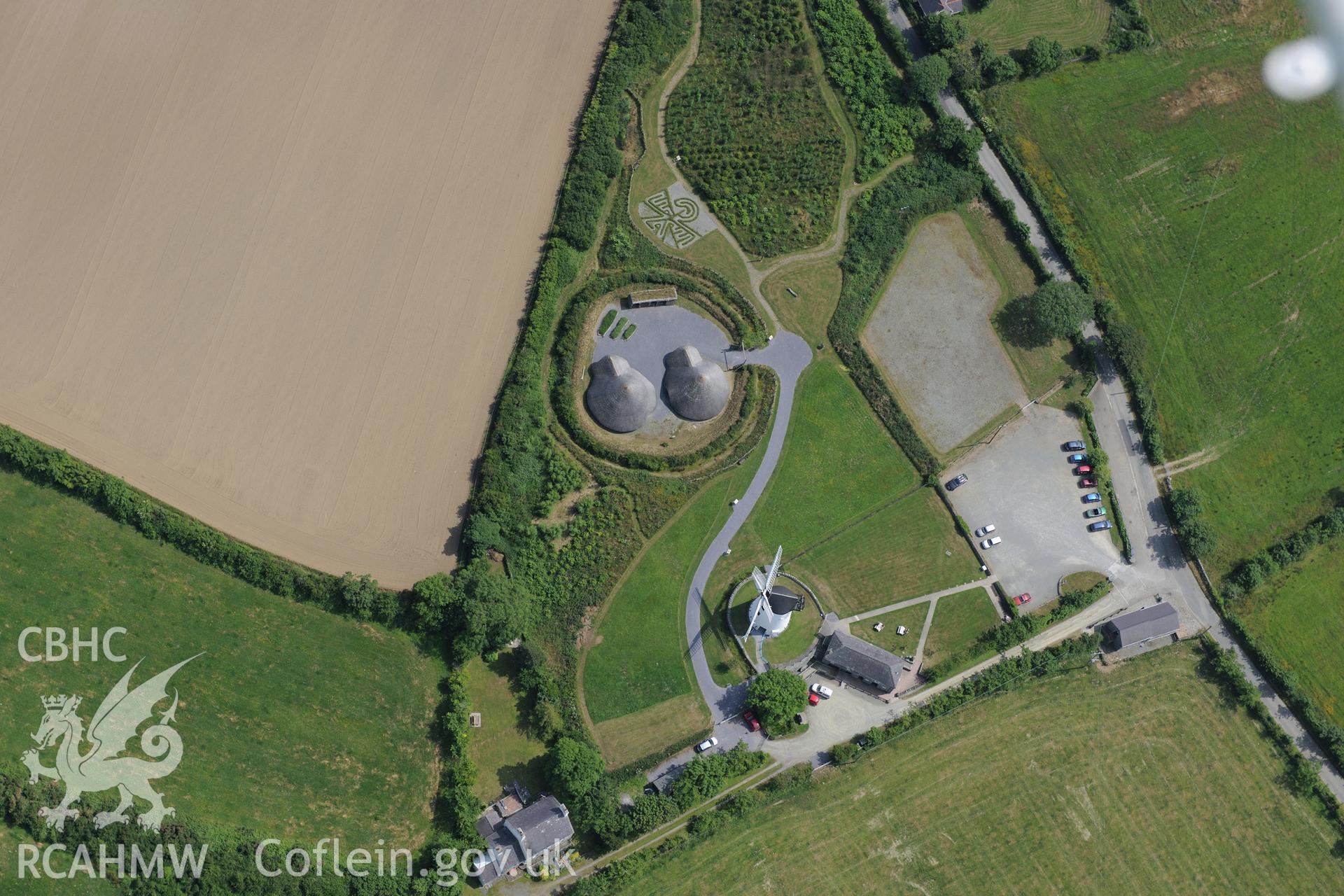 Roundhouses at Melin Llynon, Llanddeusant. Oblique aerial photograph taken during the Royal Commission?s programme of archaeological aerial reconnaissance by Toby Driver on 12th July 2013.