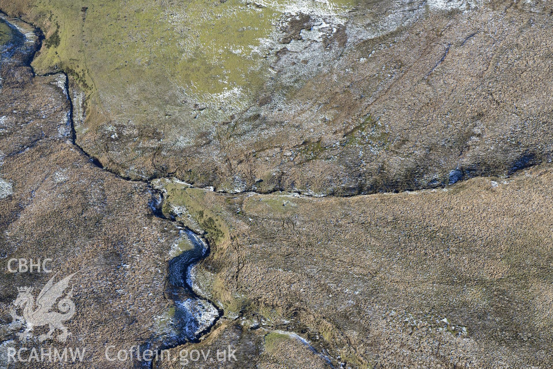 Blaen Brefi cairn, south east of Tregaron. Oblique aerial photograph taken during the Royal Commission's programme of archaeological aerial reconnaissance by Toby Driver on 4th February 2015.