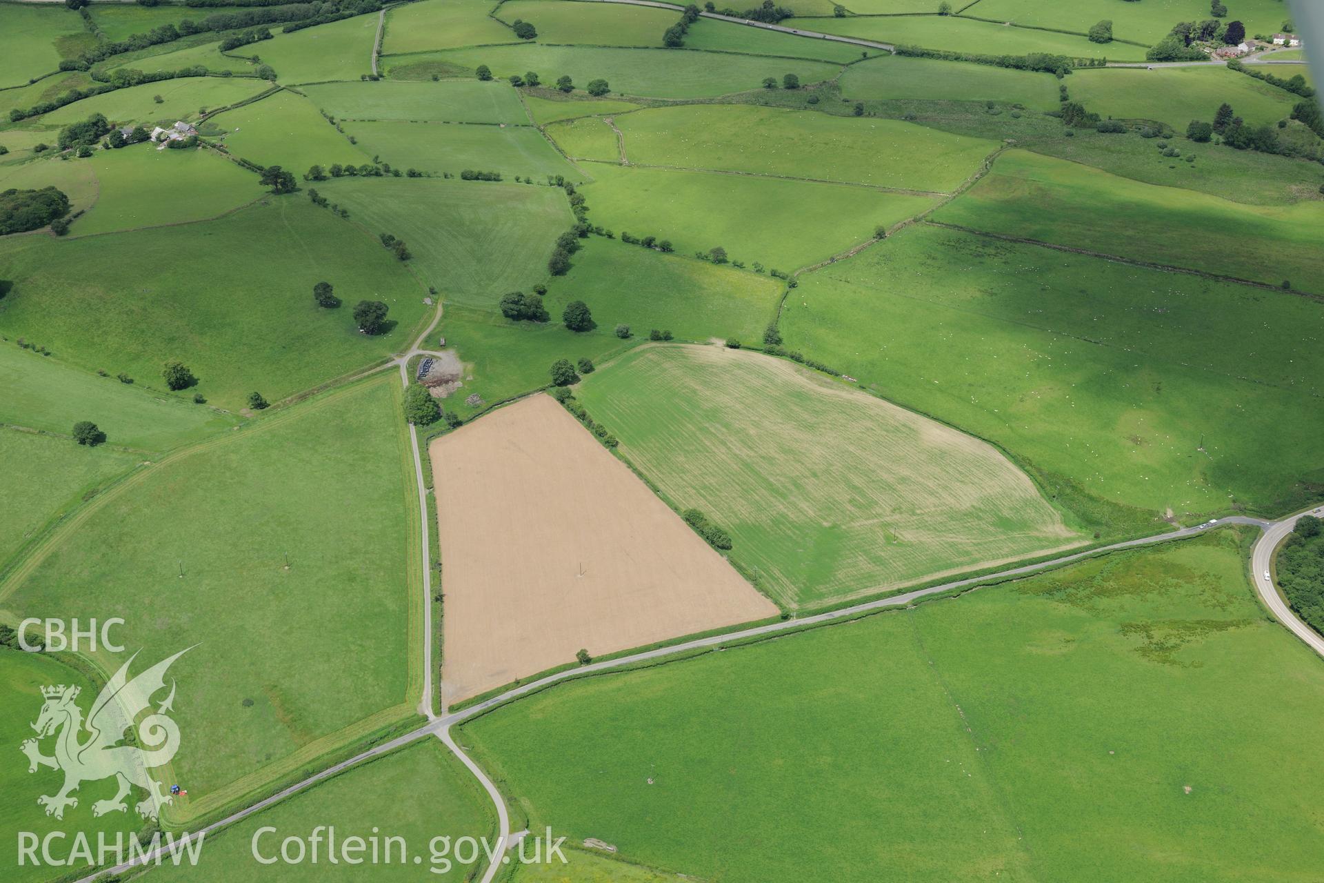 Cropmarks of Roman Camp west of Caerau Roman fort, west of Builth Wells. Oblique aerial photograph taken during the Royal Commission's programme of archaeological aerial reconnaissance by Toby Driver on 30th June 2015.