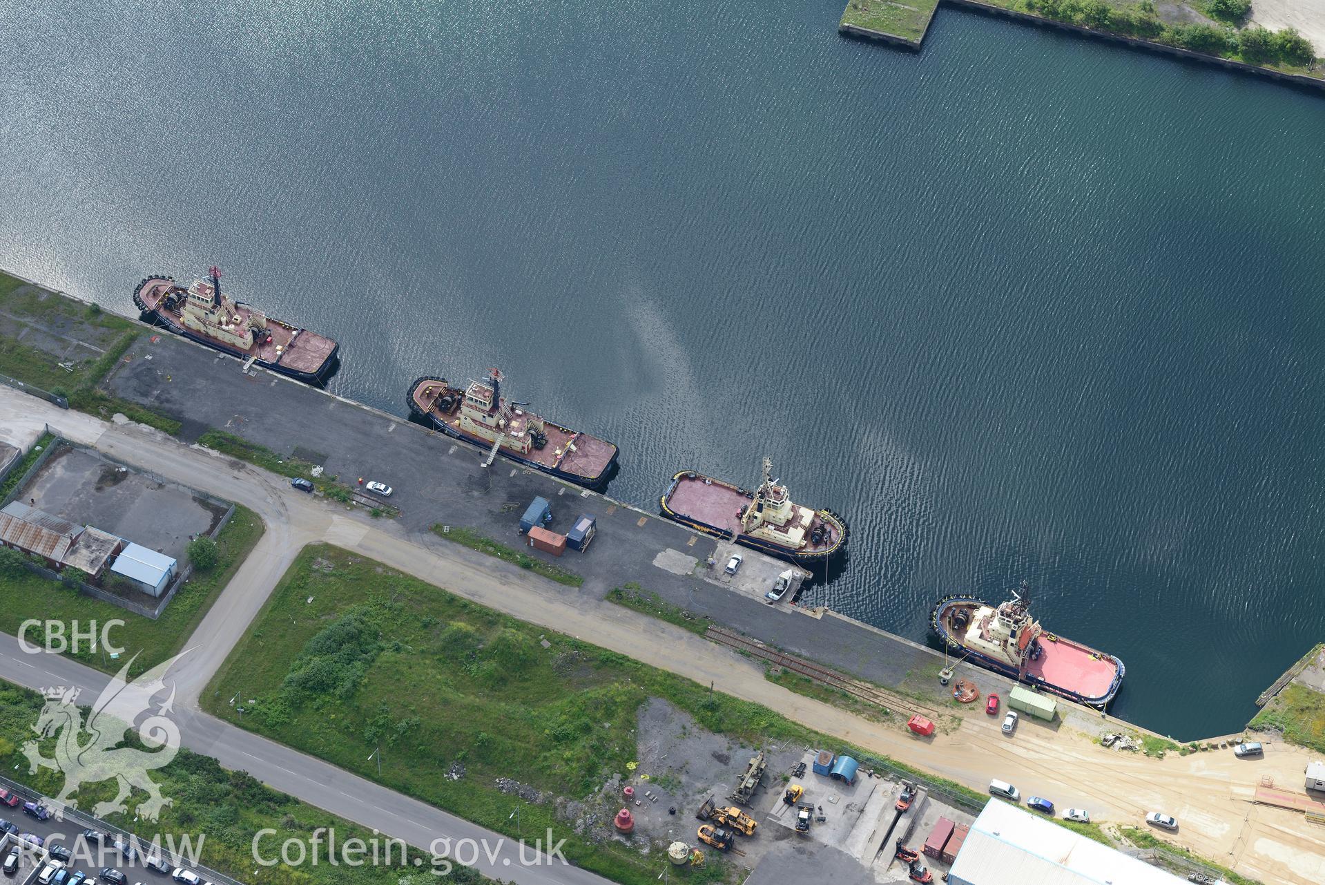 Workshops around the King's dock at Swansea Docks. Oblique aerial photograph taken during the Royal Commission's programme of archaeological aerial reconnaissance by Toby Driver on 19th June 2015.
