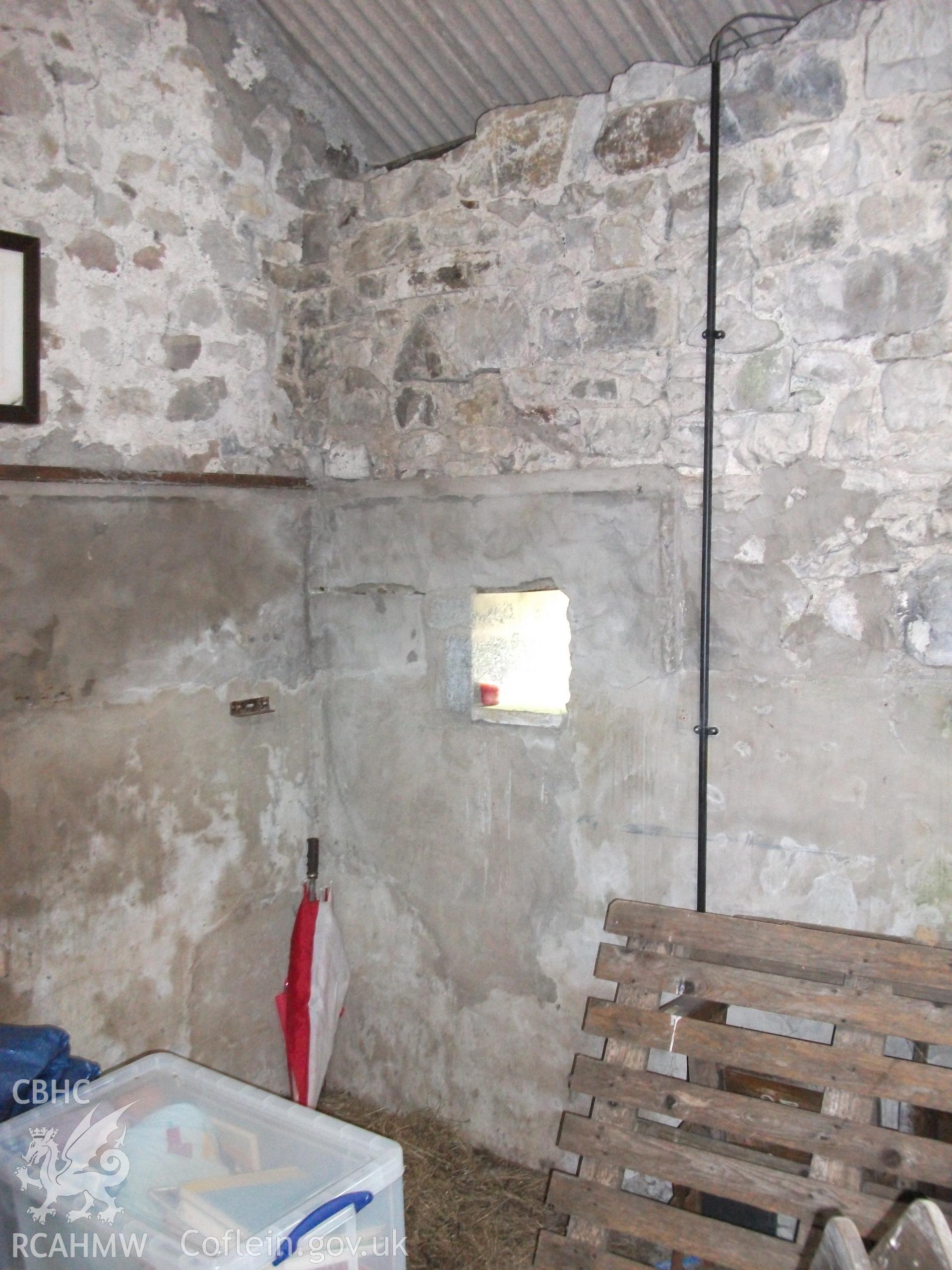 Photograph showing detailed interior view of ale and pail barn's partially plastered stone wall, at Pant-y-Castell, Maesybont, Photographed by Mark Waghorn to meet a condition attached to planning application.