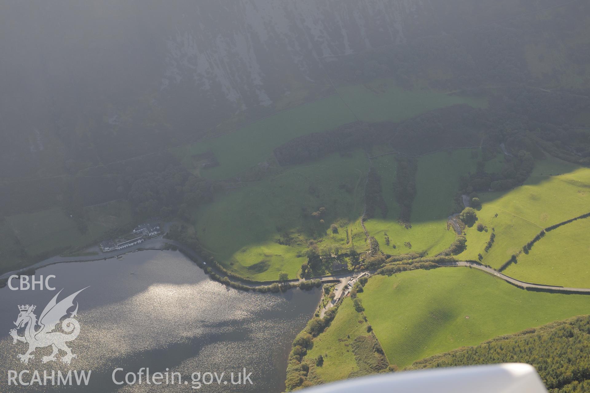 St. Mary's church, Ty'n-y-Cornel Hotel & Tal-y-Llyn enclosure or Roman fortlet, on shore of Tal-y-Llyn lake, Corris. Oblique aerial photograph taken during Royal Commission's programme of archaeological aerial reconnaissance by Toby Driver on 2/10/2015.