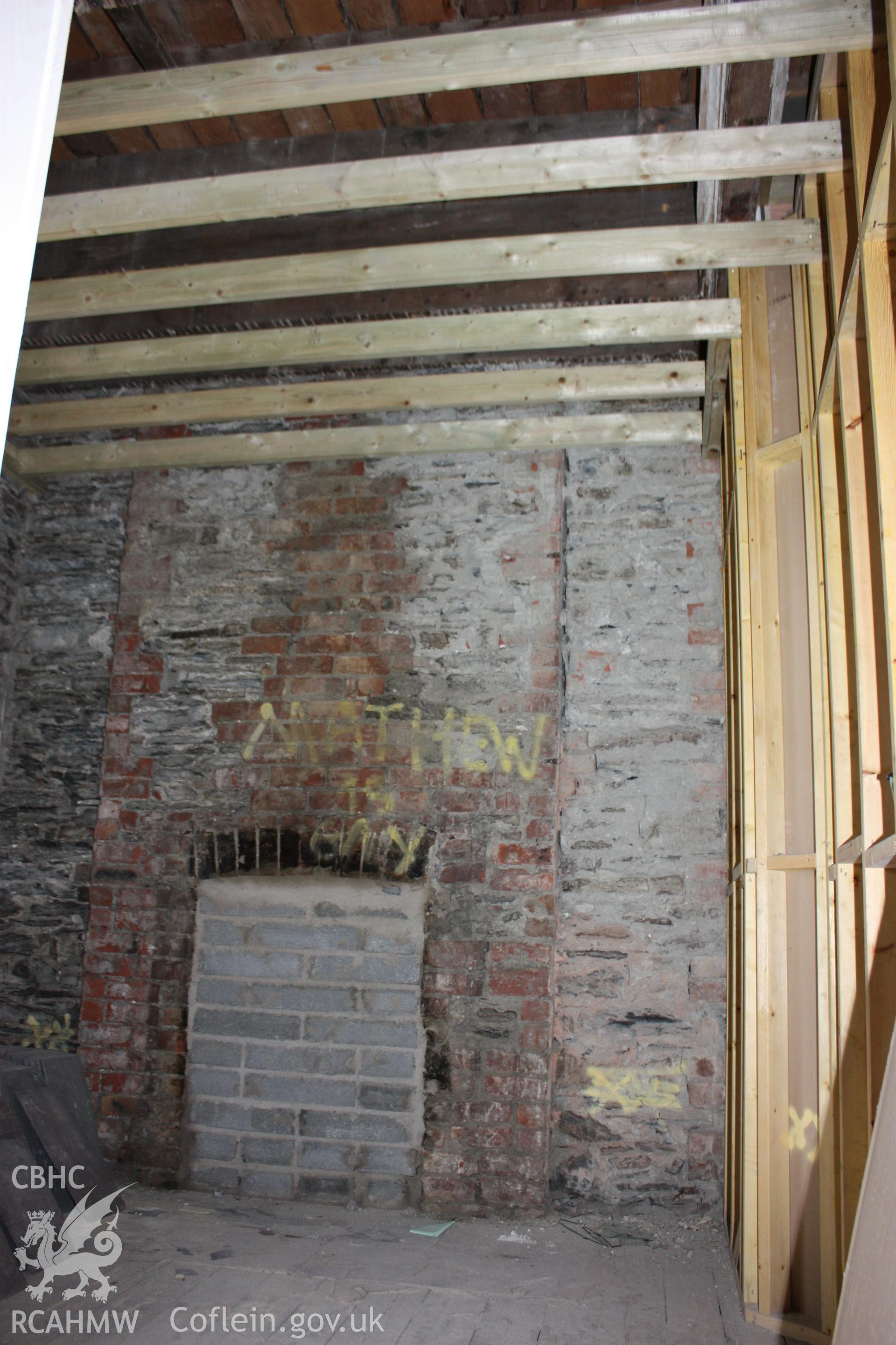 Colour photograph showing interior view of bricked up fireplace on the second floor of the Old Auction Rooms/ Liberal Club in Aberystwyth. Photographic survey conducted by Geoff Ward on 9th June 2010 during repair work prior to conversion into flats.