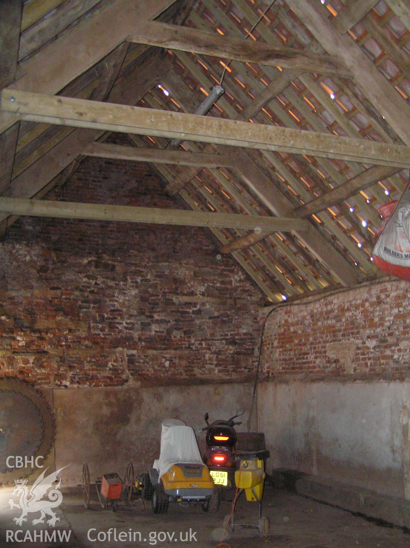 Colour photo showing interior view of the cowhouse looking south, taken by John Wheelock and donated as a condition of planning consent.