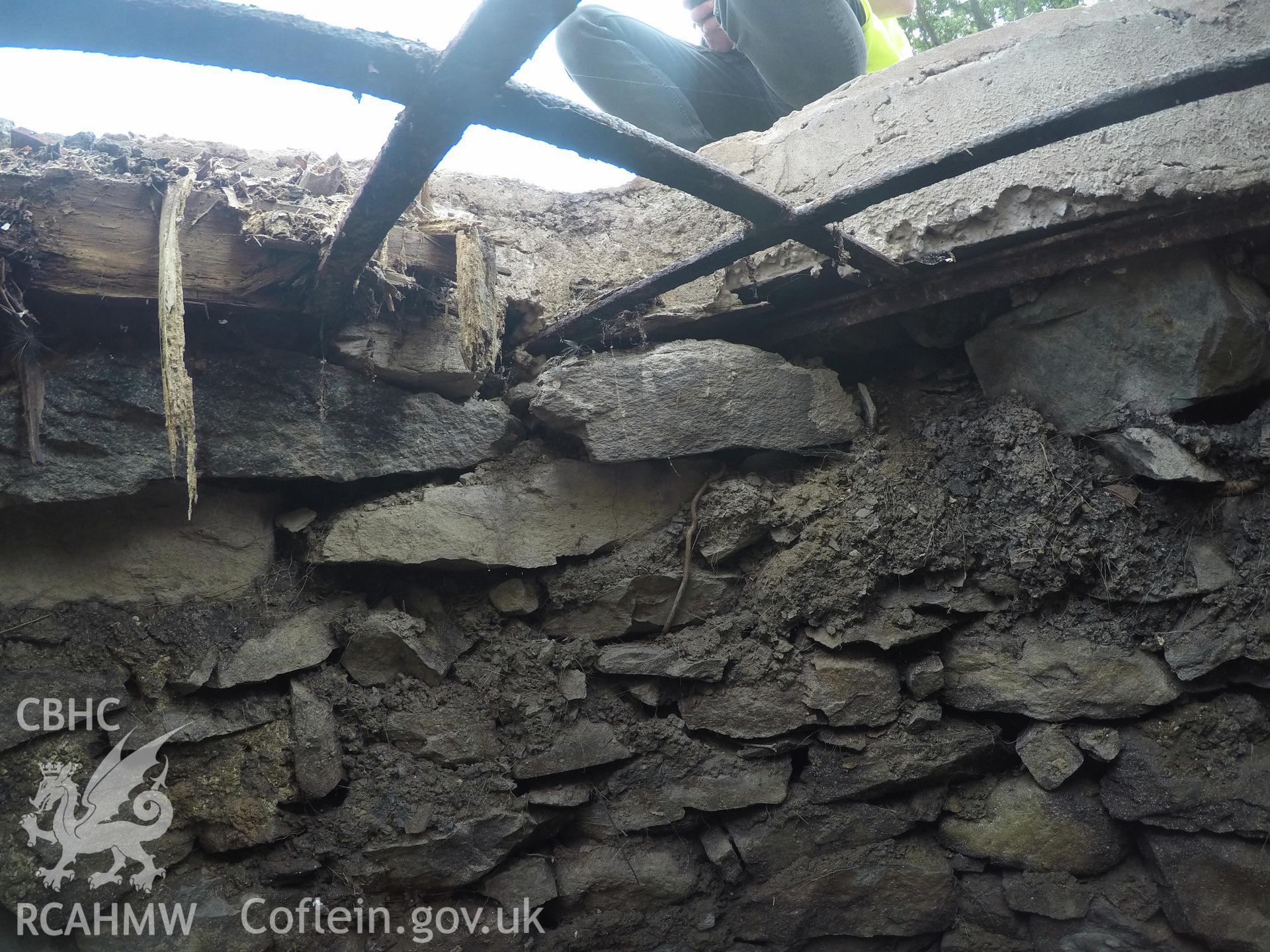 View from east of well interior at 0.4m depth. Photographed by Gwynedd Archaeological Trust as part of archaeological mitigation report for well at Plas Celynin, Henryd, Conwy, on 1st August 2018. Project no. G2568.