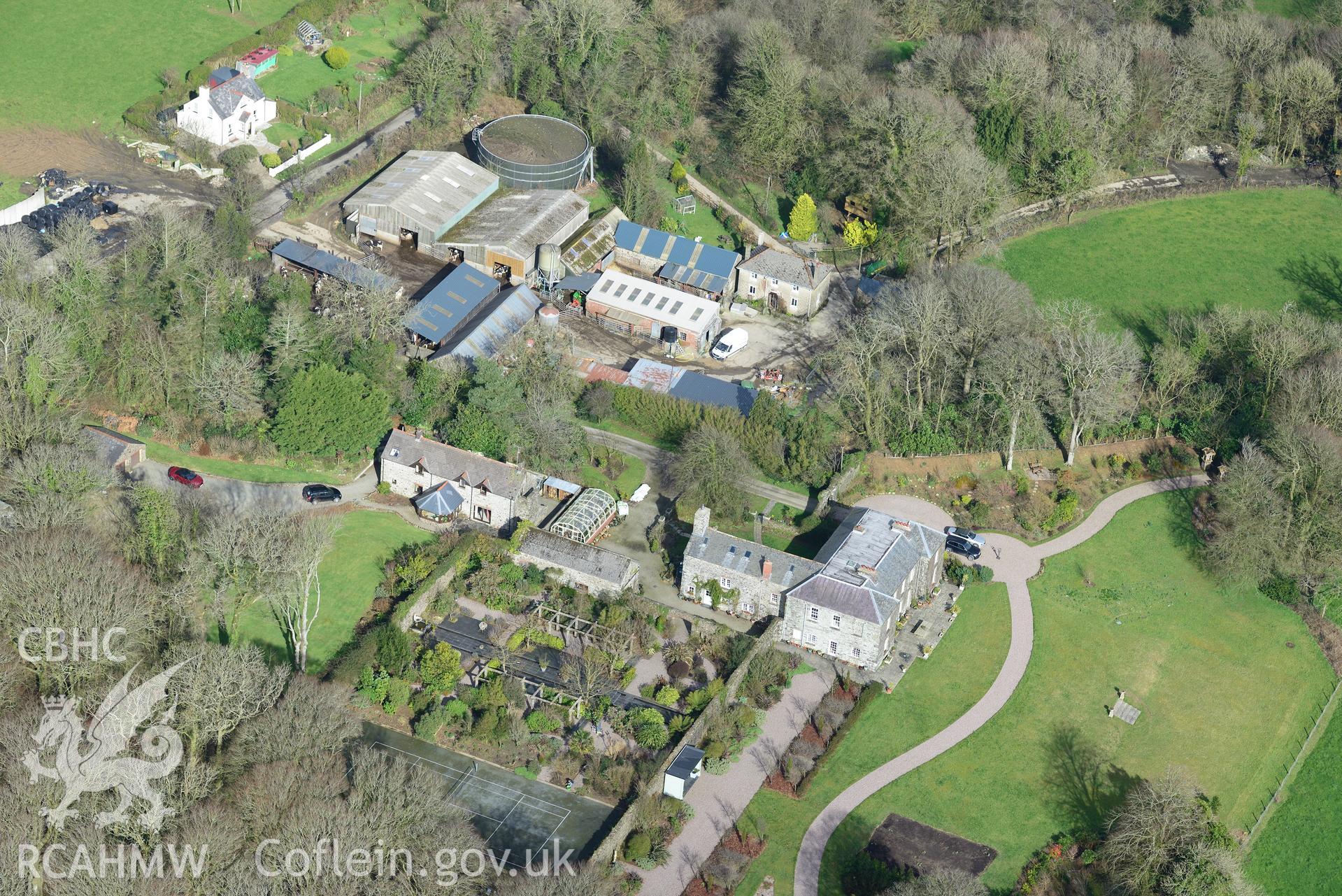 Tregarn Hall and the associated garden and coach house. Oblique aerial photograph taken during the Royal Commission's programme of archaeological aerial reconnaissance by Toby Driver on 13th March 2015.