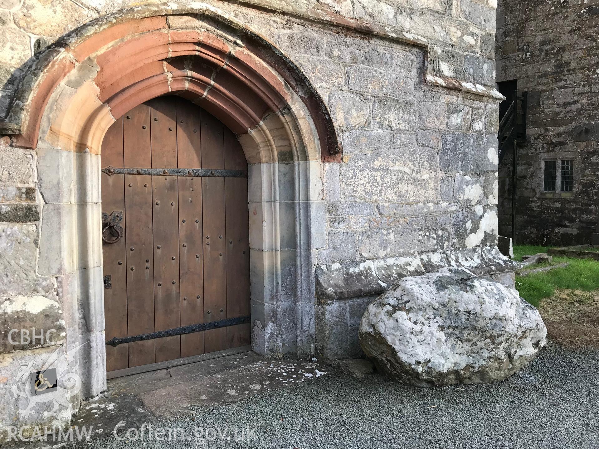 Colour photo showing St. Bueno's stone outside the door to St. Buenno's Church, Clynnog Fawr, taken by Paul R. Davis, 23rd June 2018.