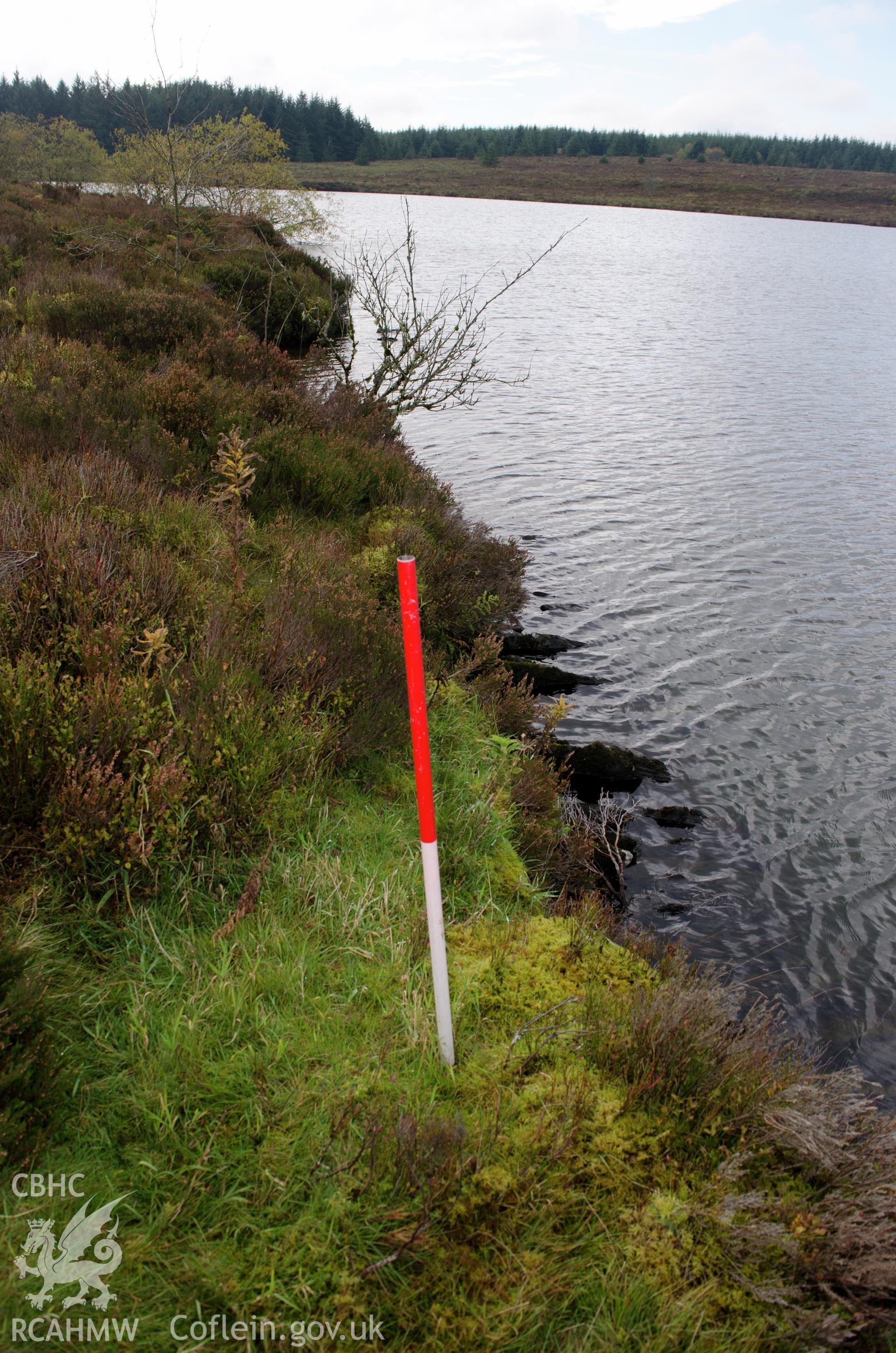 View from the north of shale slabs on end forming the side of the reservoir at Llyn Bran, Mynydd Hiraethog. Photographed on 15th October 2018 by Gwynedd Archaeological Trust, as part of archaeological assessment of Llyn Bran. Project no. 2573.