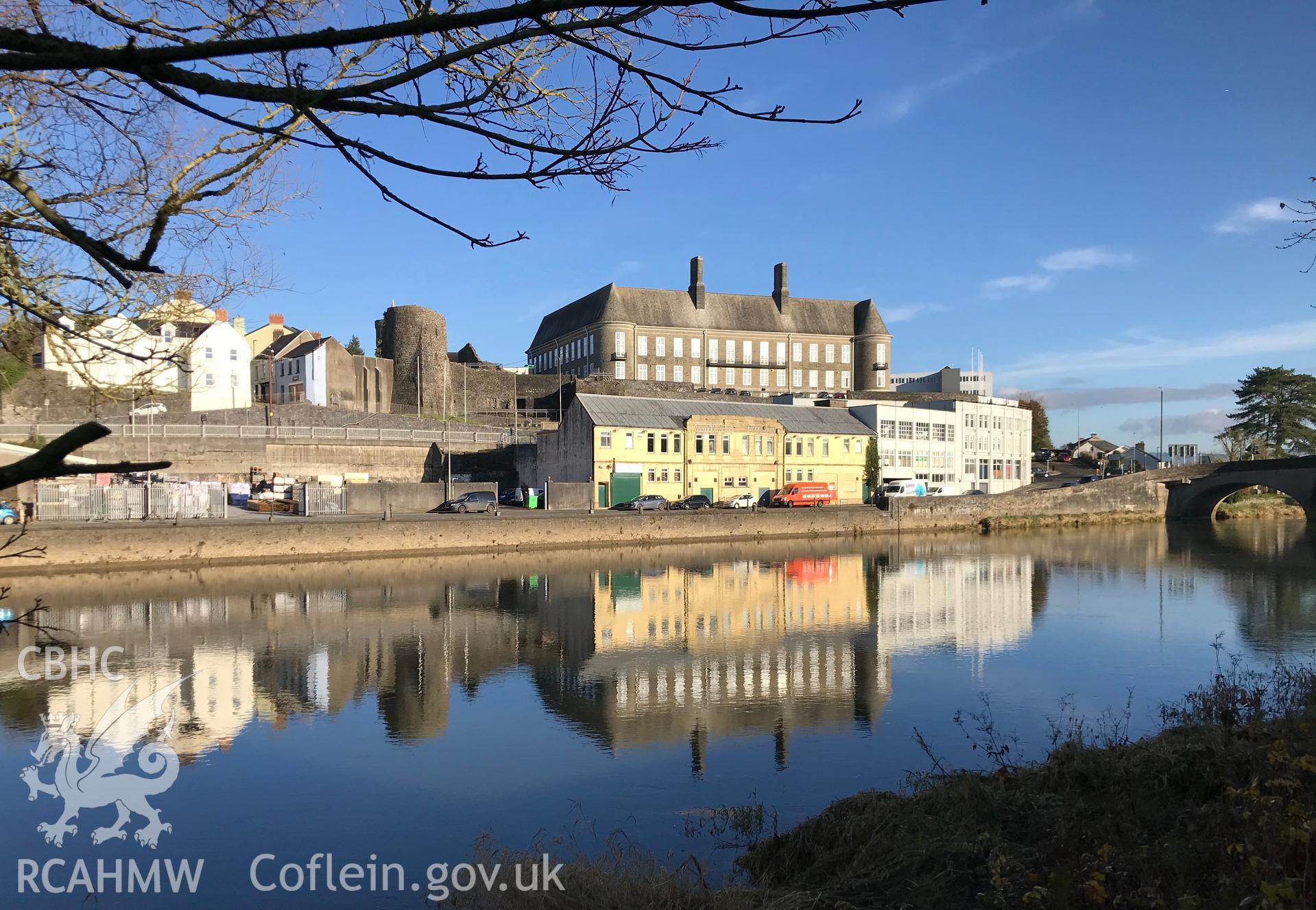 Digital colour photograph showing Carmarthen County Hall and Carmarthen Castle, overlooking the river Tywi, taken by Paul Davis on 20th November 2019.