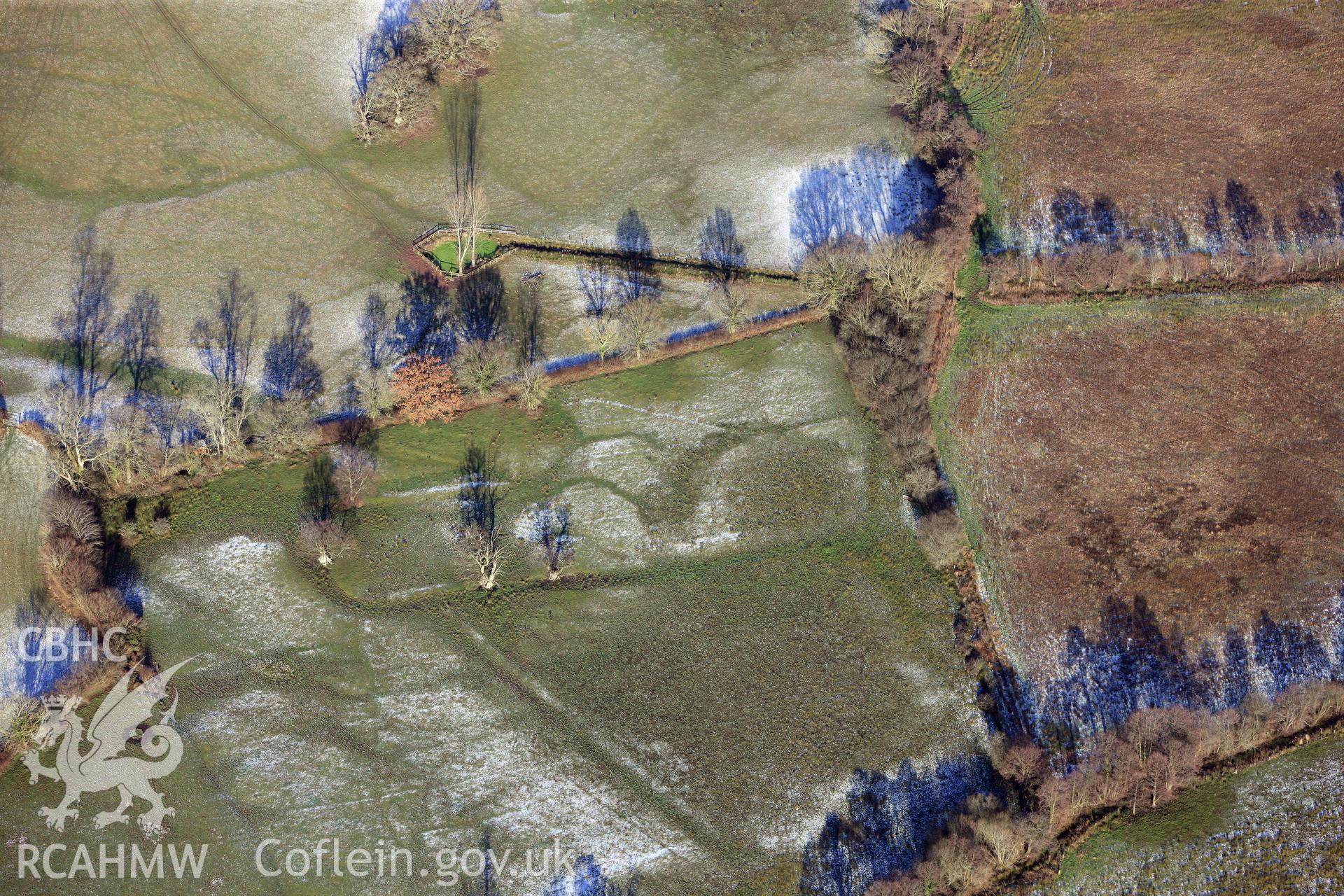 The village of Llangasty-Talyllyn and surrounding fields, south east of Brecon. Oblique aerial photograph taken during the Royal Commission?s programme of archaeological aerial reconnaissance by Toby Driver on 15th January 2013.