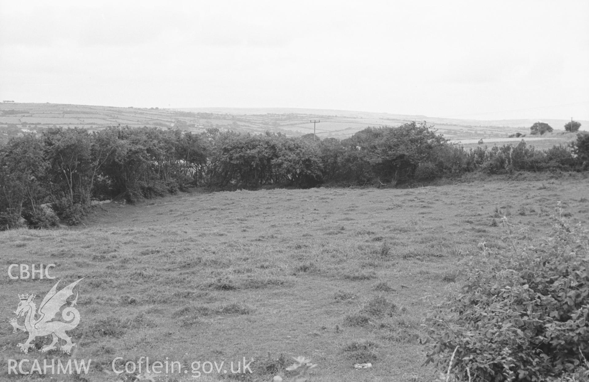 Digital copy of a black and white negative showing site of Castell Pridd (in front of hedge, centre). Photographed in August 1963 by Arthur O. Chater from Grid Reference SN 2950 4963, looking north north east.