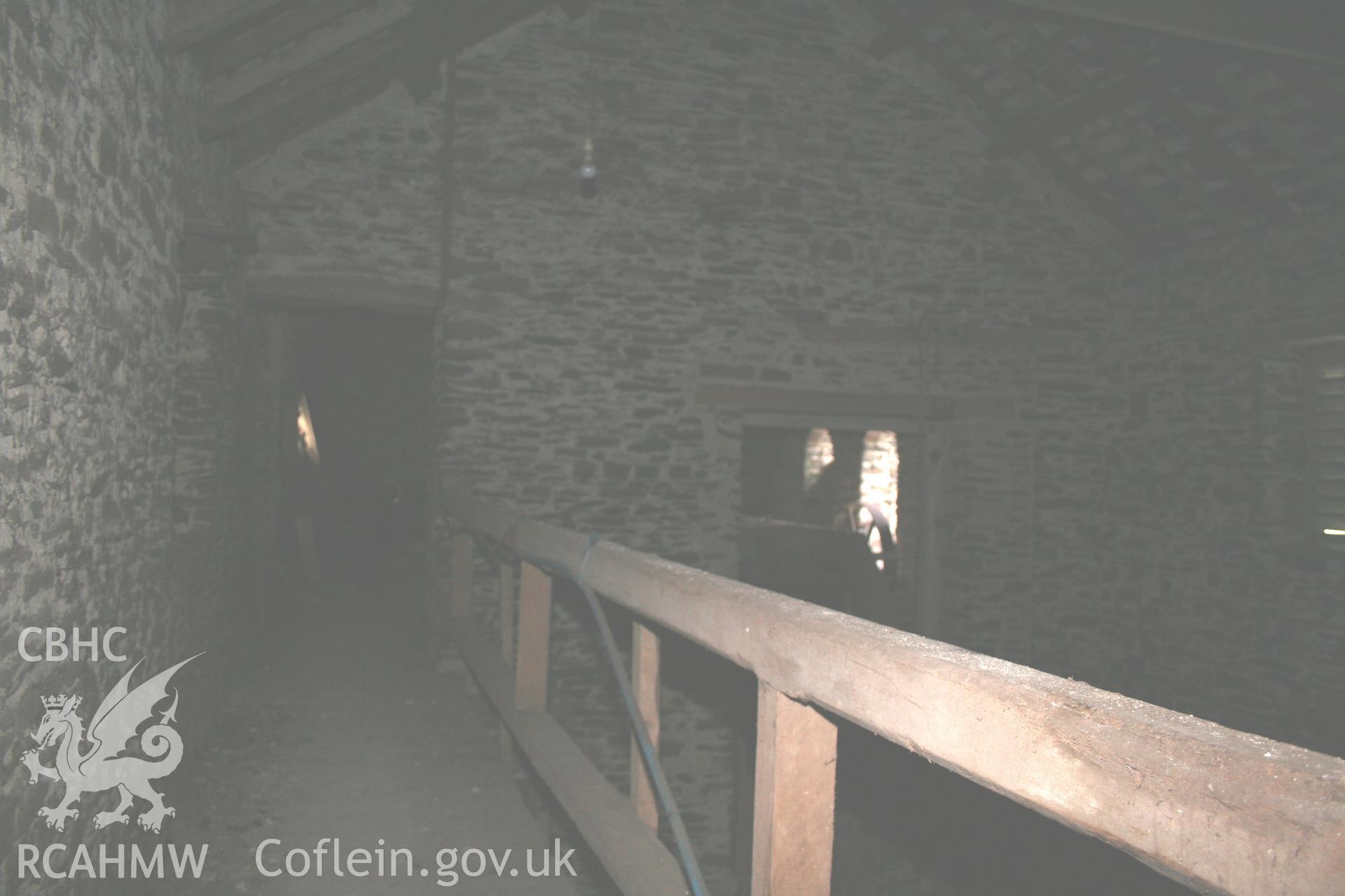 Interior view of gallery running along straw house. Photographic survey of the threshing house, straw house, mixing house and root house at Tan-y-Graig Farm, Llanfarian, conducted by Geoff Ward and John Wiles, 11th December 2006.