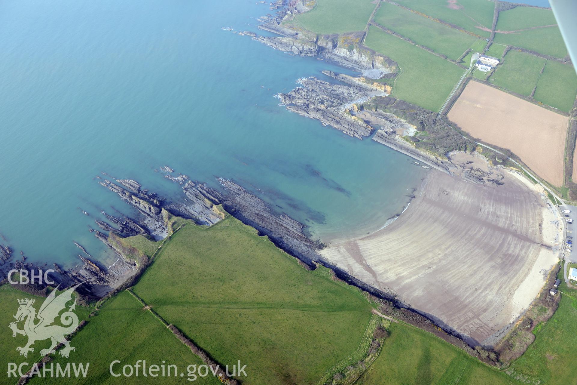 Royal Commission aerial photograph of West Angle Bay promontory fort taken on 27th March 2017. Baseline aerial reconnaissance survey for the CHERISH Project. ? Crown: CHERISH PROJECT 2017. Produced with EU funds through the Ireland Wales Co-operation Programme 2014-2020. All material made freely available through the Open Government Licence.