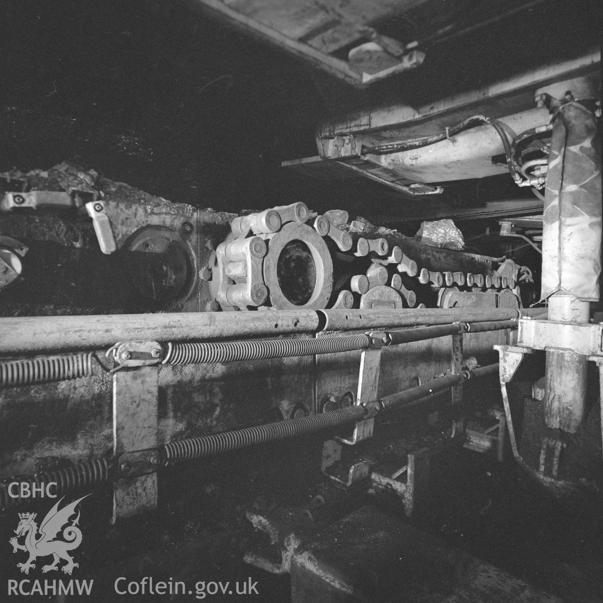 Digital copy of an acetate negative showing chain drive of shearer above coal face at Blaenant Colliery, from the John Cornwell Collection.