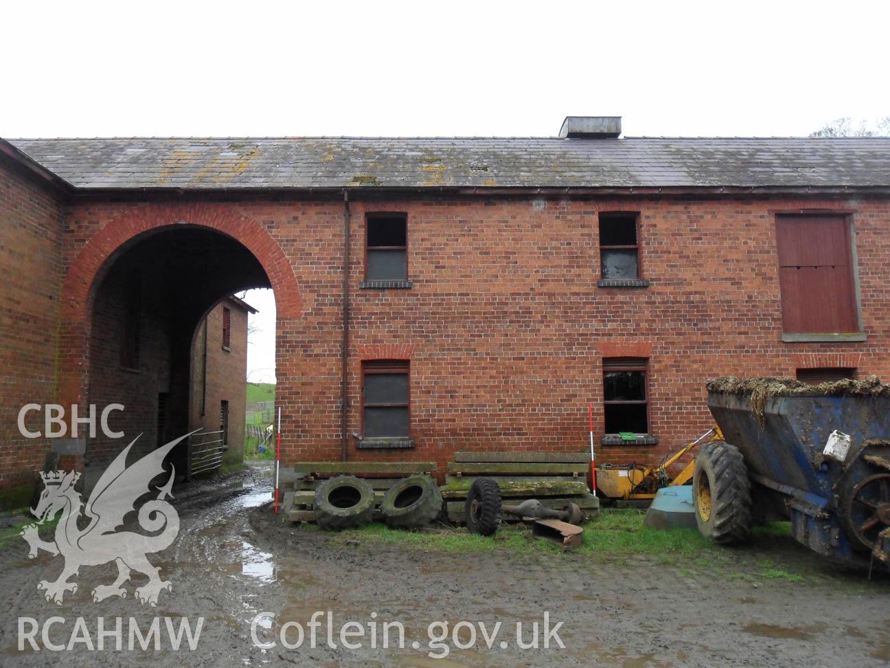 'View of stables from within cobbled central courtyard, Scales 2x2m, Looking north west.' Photographed as part of archaeological desk based assessment and building recording undertaken by Archaeology Wales in March 2013. Report no. 1108.