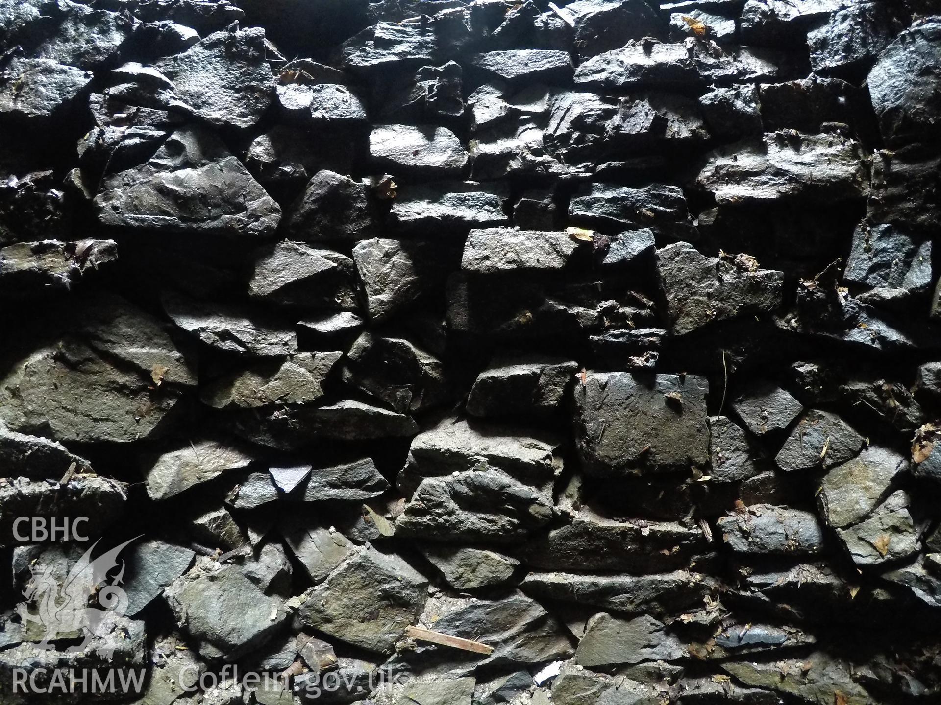 View from the west of well interior at 4.0m depth. Photographed by Gwynedd Archaeological Trust as part of archaeological mitigation report for well at Plas Celynin, Henryd, Conwy, on 1st August 2018. Project no. G2568.