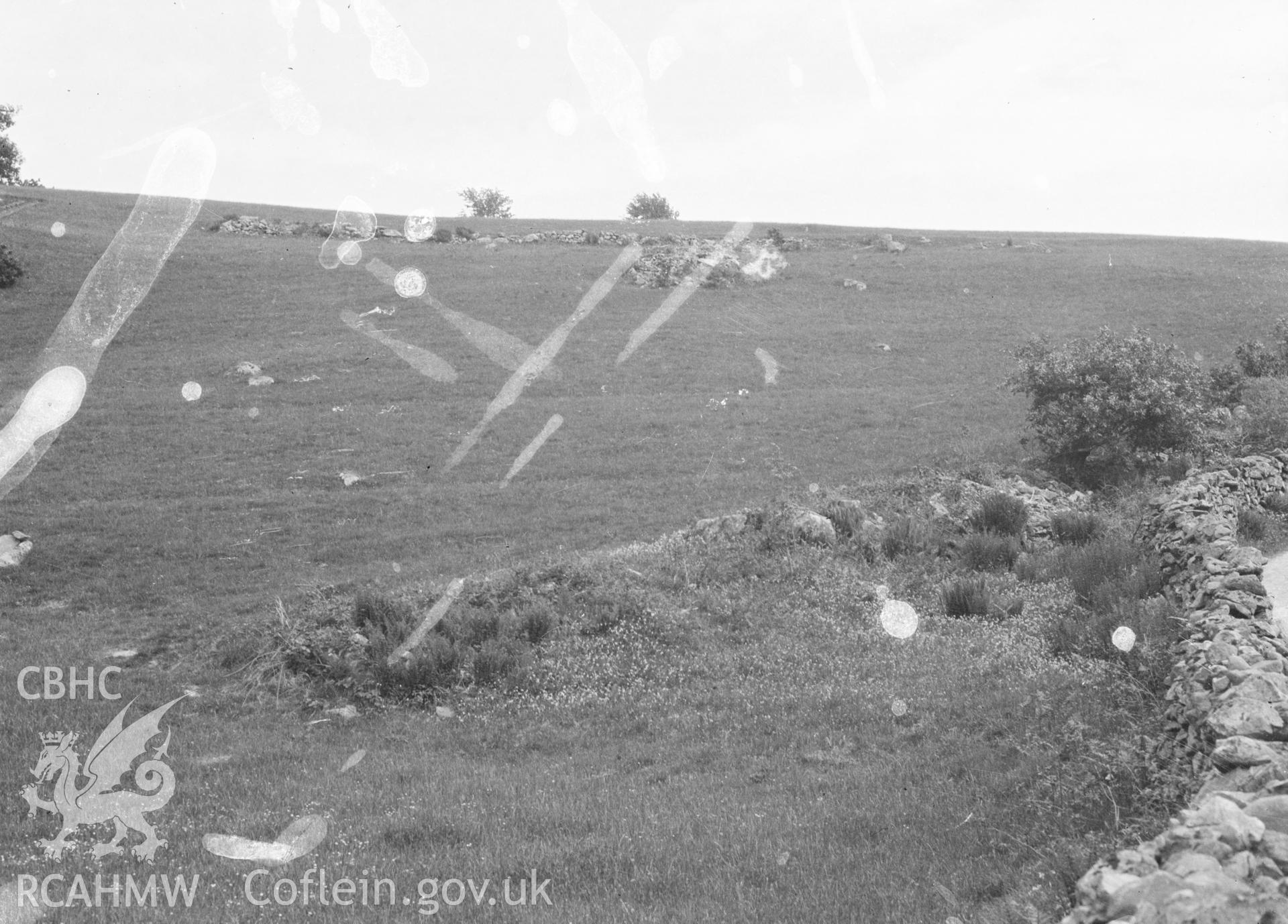 Digital copy of nitrate negative showing Bryn y Gefeiliau Roman site. Transcript of reverse of photograph: 'Caernarvon. Capel Curig. Roman Road below Bryn y Gefeiliau farm where it diverges from modern road up to farm.' Cadw Monuments in Care Collection.