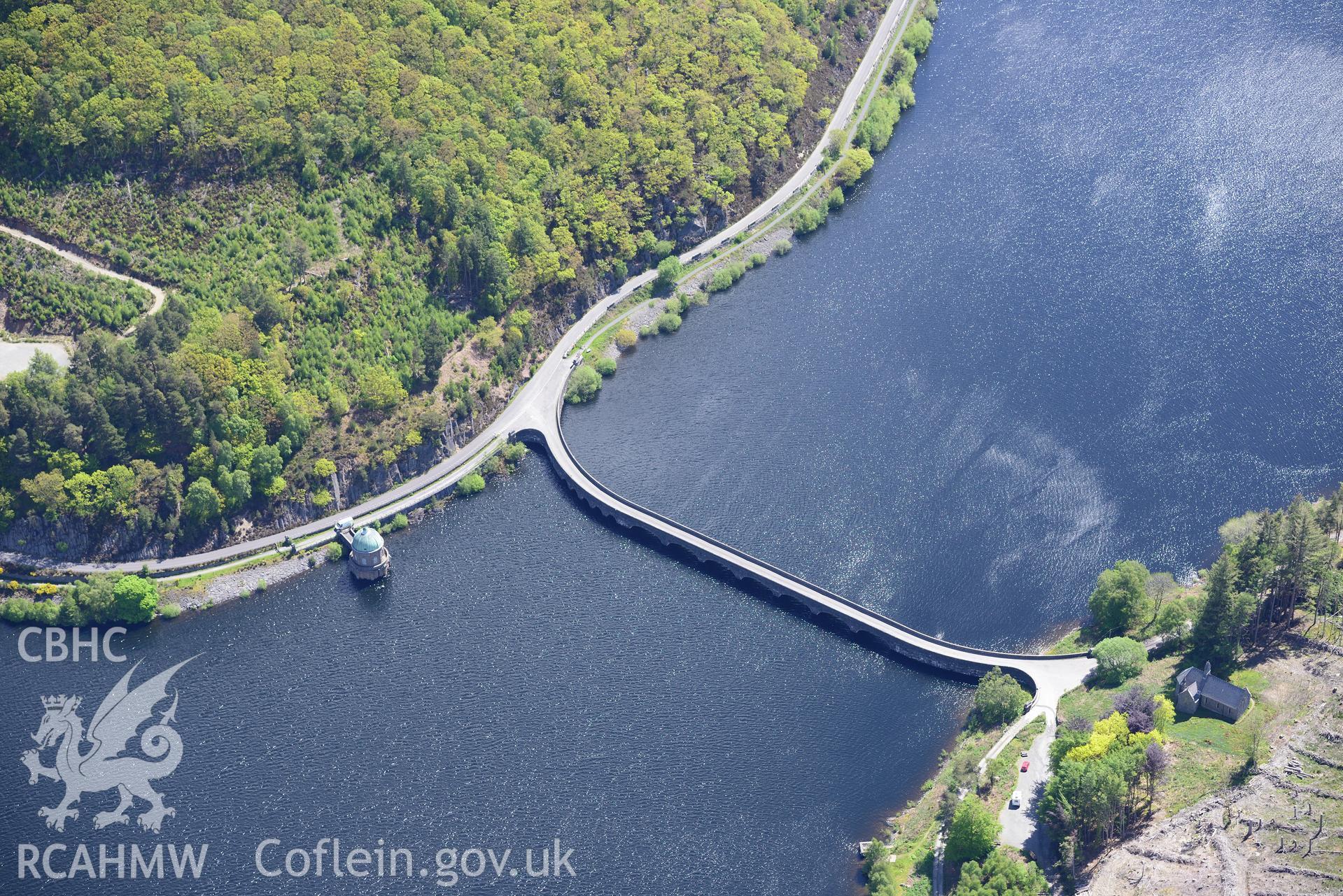 Nantgwyllt church and Garreg-Ddu dam, valve tower and reservoir at the Elan Valley water scheme. Oblique aerial photograph taken during the Royal Commission's programme of archaeological aerial reconnaissance by Toby Driver on 3rd June 2015.