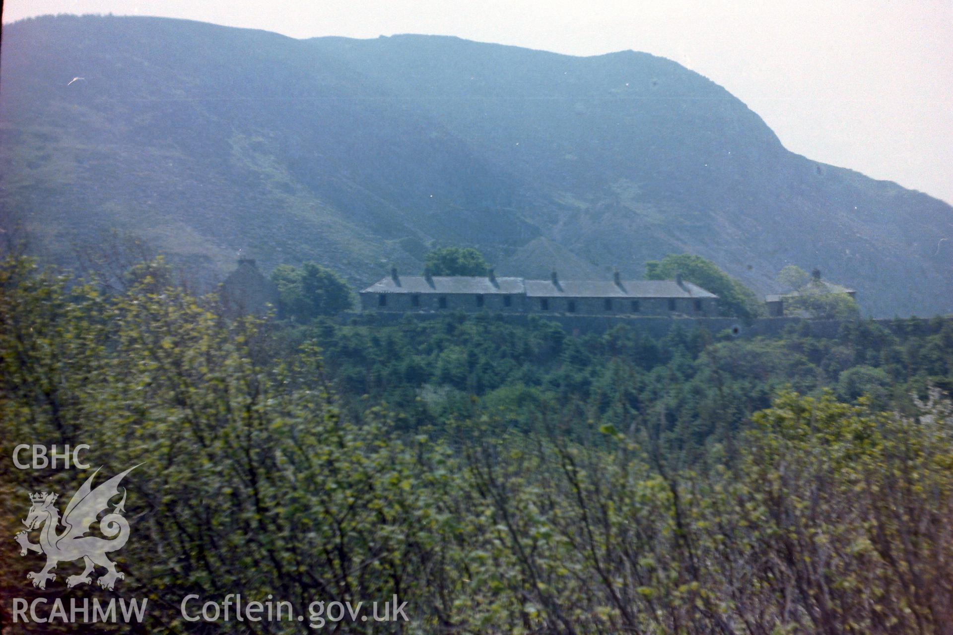 Digitised colour photograph of a row of terraces houses at Porth-y-Nant. Produced during a Bachelor of Architecture dissertation: 'The Form & Architecture of Nineteenth Century Industrial Settlements in Rural Wales' by Martin Davies, 1979.