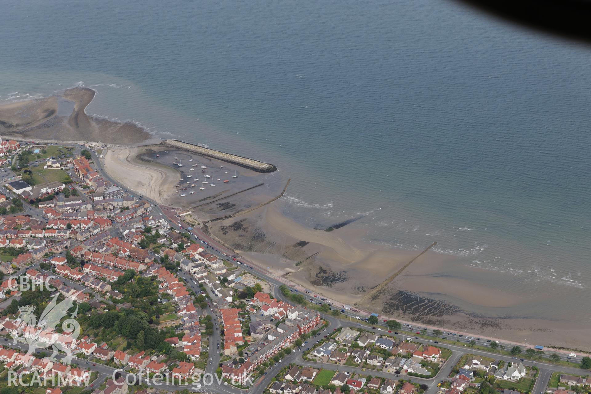 The village of Rhos-on-Sea and the fishtrap just off the coast. Oblique aerial photograph taken during the Royal Commission's programme of archaeological aerial reconnaissance by Toby Driver on 11th September 2015.
