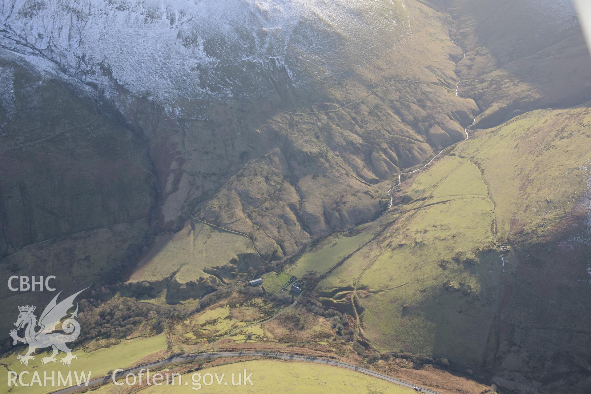 Penantigi Uchaf farm, east of Dolgellau. Oblique aerial photograph taken during the Royal Commission's programme of archaeological aerial reconnaissance by Toby Driver on 4th February 2015.