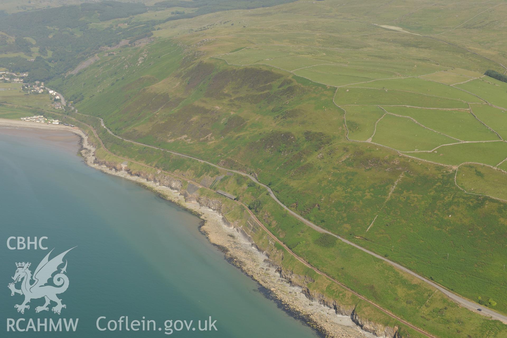 Friog Rocks avalanche shelter on the Cambrian Coast Line between Llwyngwril and Fairbourne. Oblique aerial photograph taken during the Royal Commission?s programme of archaeological aerial reconnaissance by Toby Driver on 12th July 2013.