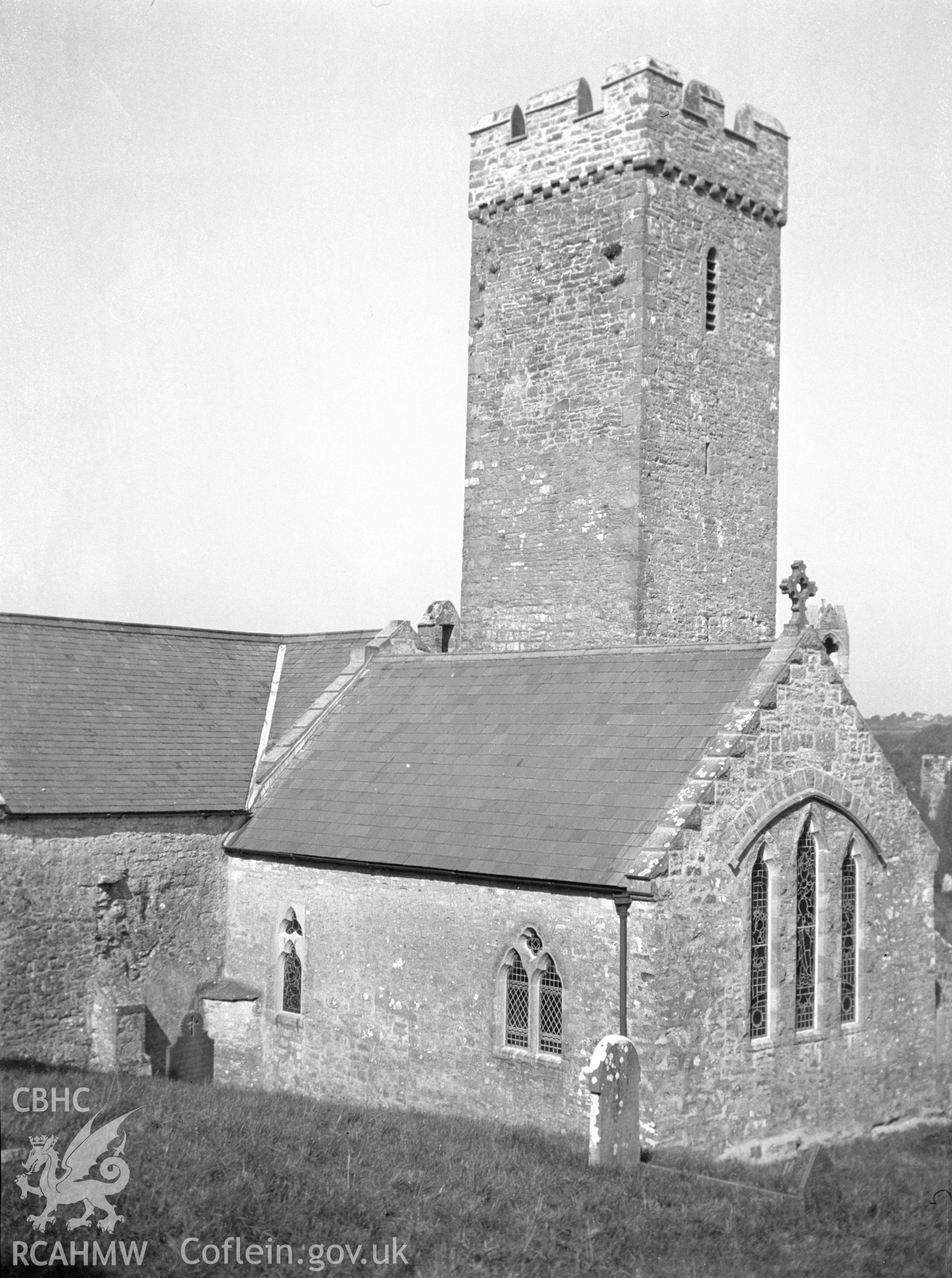 Digital copy of a nitrate negative showing exterior view of tower and east end of St James's Church, Manorbier. From the National Building Record Postcard Collection.