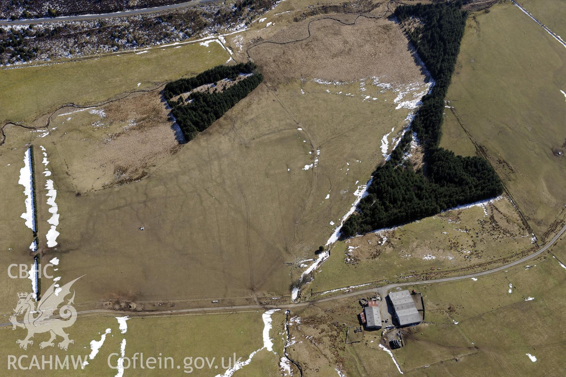 Llys Arthur defended enclosure, north east of Ponterwyd. Oblique aerial photograph taken during the Royal Commission's programme of archaeological aerial reconnaissance by Toby Driver on 2nd April 2013.