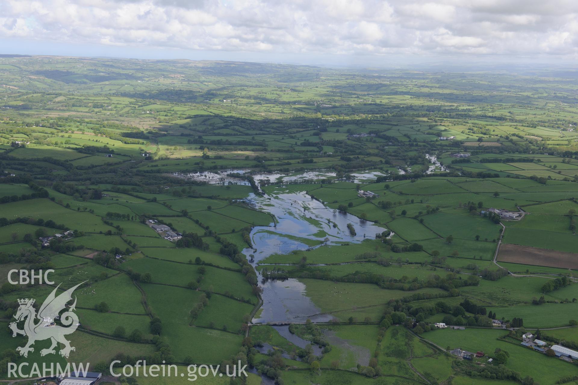 Flooding near Pont Gogoyan, Llanddewi Brefi. Oblique aerial photograph taken during the Royal Commission's programme of archaeological aerial reconnaissance by Toby Driver on 3rd June 2015.