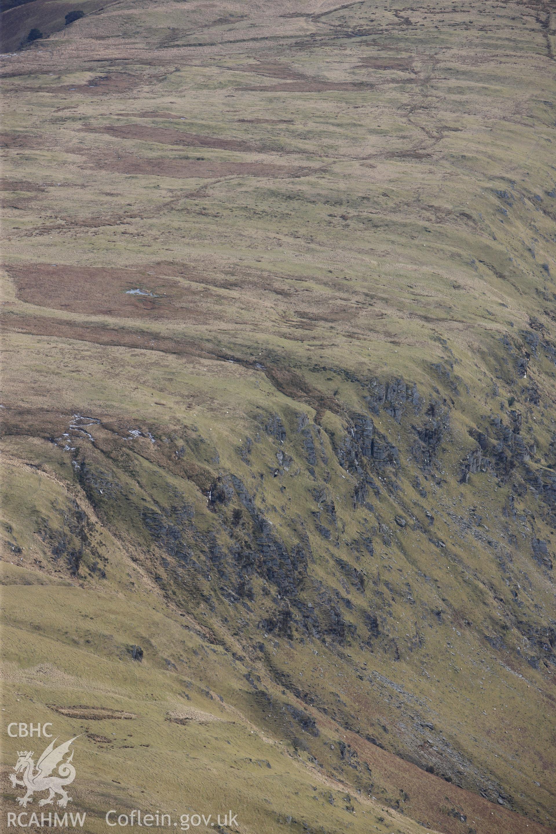 Esgair Irfon cairn in the Cambrian Mountains, north west of Llangurig. Oblique aerial photograph taken during the Royal Commission?s programme of archaeological aerial reconnaissance by Toby Driver on 28th February 2013.