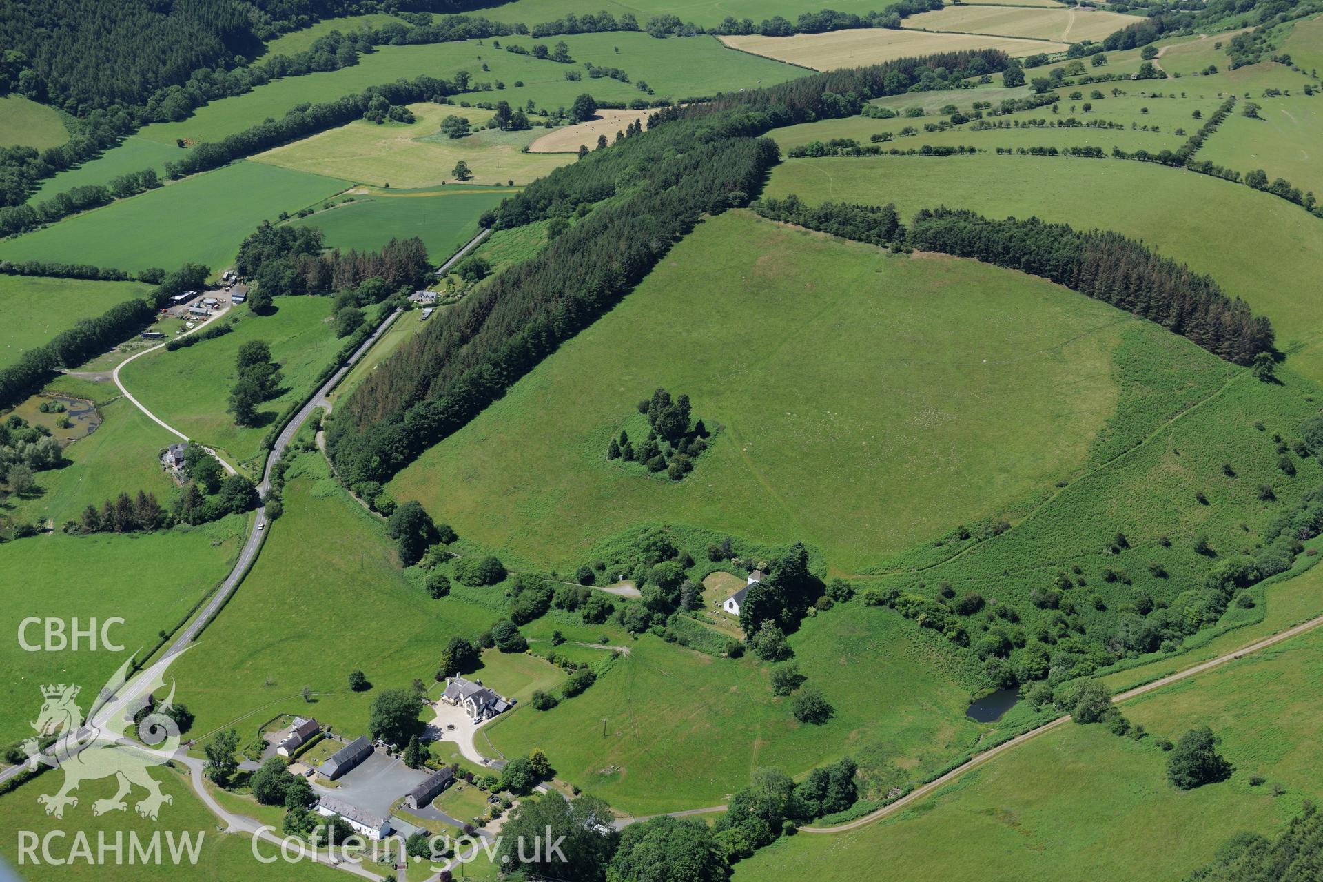 Pilleth Court, including the associated farm complex and buildings. St. Mary's church and the site of the Battle at Bryn Glas is also visible. Oblique aerial photograph taken during the Royal Commission's programme of archaeological aerial reconnaissance by Toby Driver on 30th June 2015.