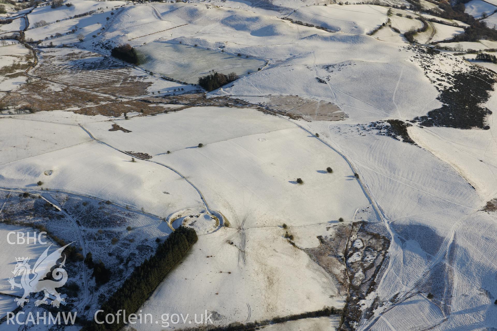 Waun Gynllwch or Coed Caeau defended enclosure, south of Builth Wells. Oblique aerial photograph taken during the Royal Commission?s programme of archaeological aerial reconnaissance by Toby Driver on 15th January 2013.