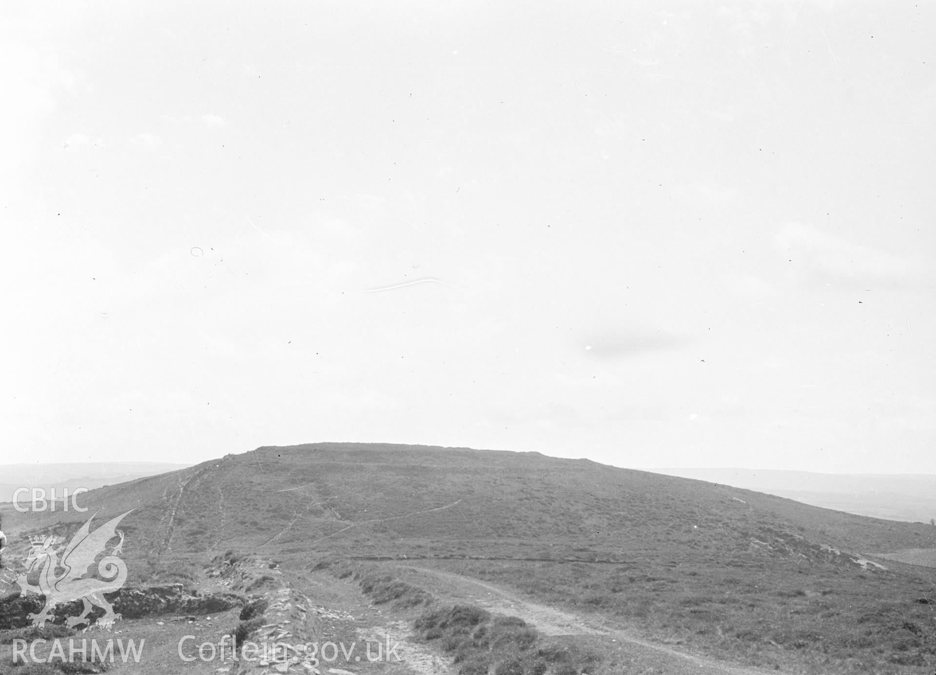 Digital copy of a nitrate negative showing Bwlch Castell Hill Fort. Reverse of black and white photograph reads: 'Cardigan / Cilcennin / Bwlch Castell Hill Fort.' From the Cadw Monuments in Care Collection.