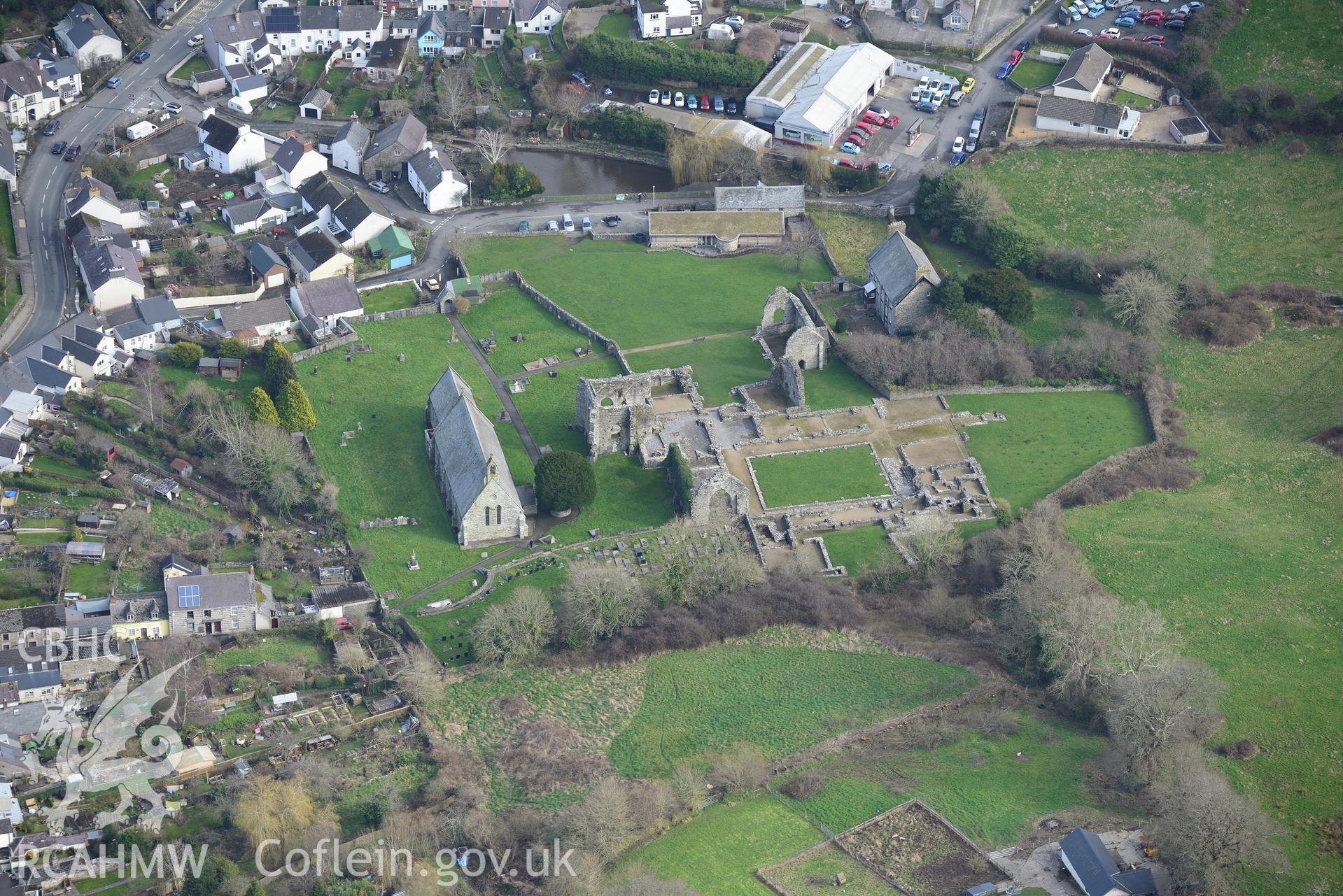 St. Dogmael's Abbey; St. Thomas the Apostle Church; The Vicarage and the Vicarage Stables and Coach House, St. Dogmaels. Oblique aerial photograph taken during the Royal Commission's programme of archaeological aerial reconnaissance by Toby Driver on 13th March 2015.