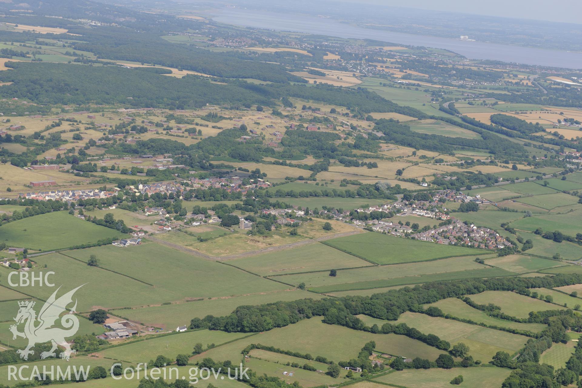 St. Stephen's church and Venta Silurum (Caerwent Roman City), Caerwent, south west of Chepstow. Oblique aerial photograph taken during the Royal Commission?s programme of archaeological aerial reconnaissance by Toby Driver on 1st August 2013.