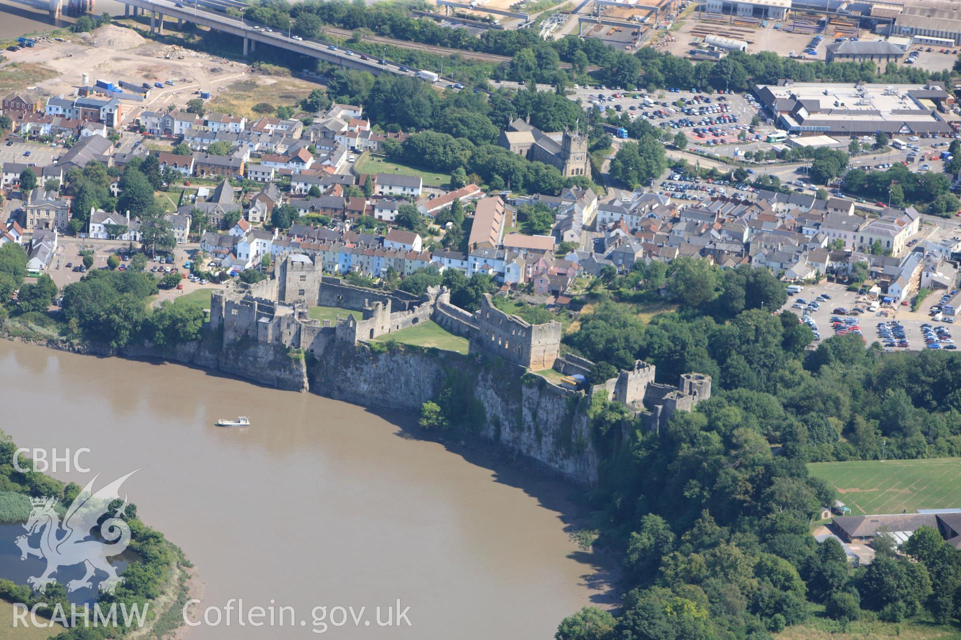 Chepstow Castle and St. Mary's church, Chepstow. Oblique aerial photograph taken during the Royal Commission?s programme of archaeological aerial reconnaissance by Toby Driver on 1st August 2013.