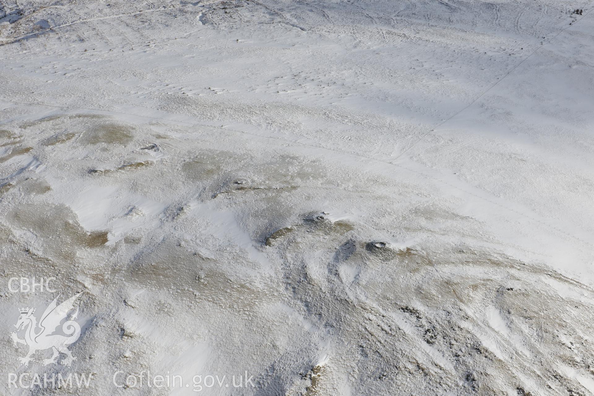 Cairn cemetery at Pen Pumlumon Arwystli, north west of Llangurig. Oblique aerial photograph taken during the Royal Commission's programme of archaeological aerial reconnaissance by Toby Driver on 4th February 2015.