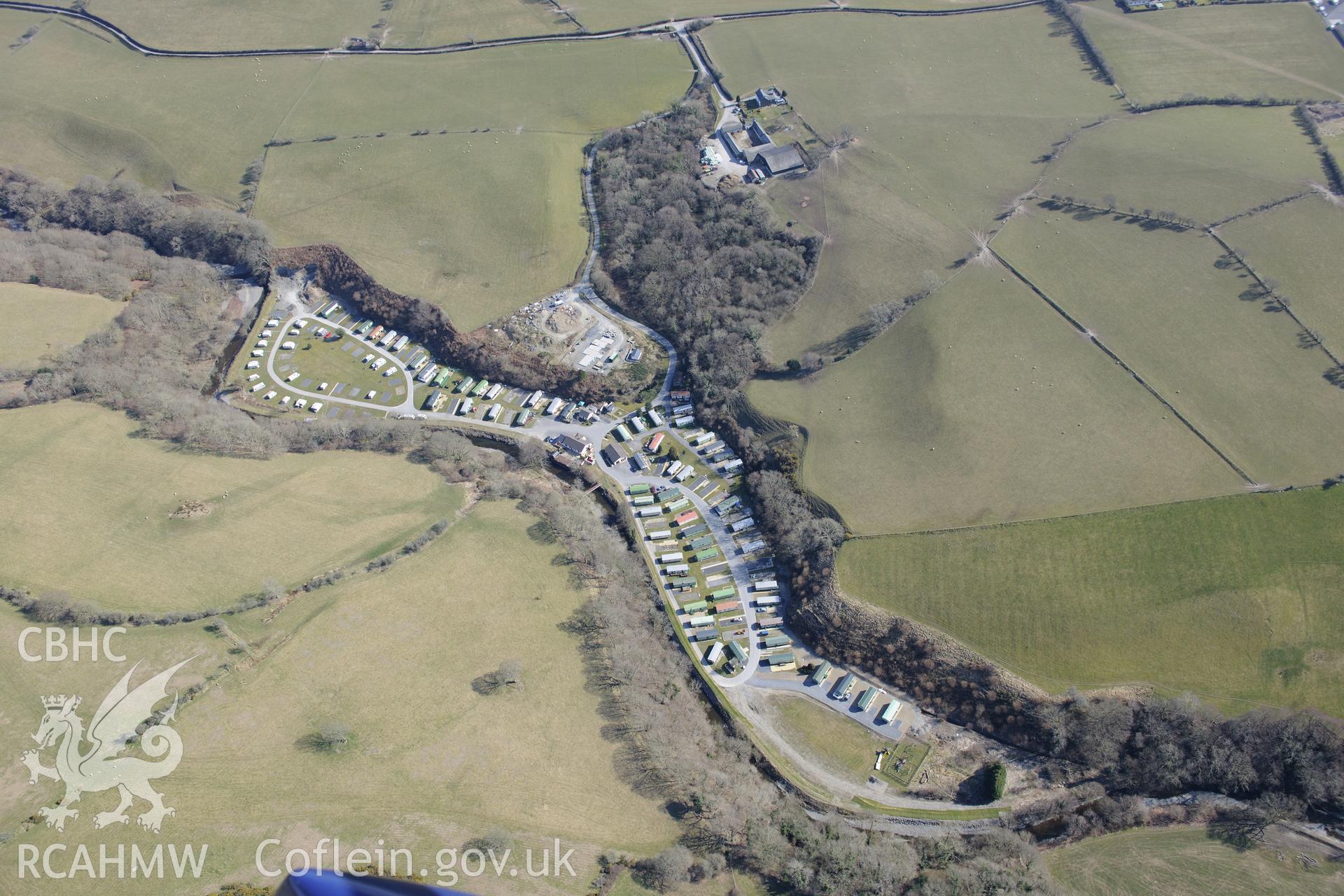 Site of former Forge Factory Woollen mill (now a caravan park), and Glanfred farm, north east of Llandre, Aberystwyth. Oblique aerial photograph taken during the Royal Commission's programme of archaeological aerial reconnaissance by Toby Driver on 2nd April 2013.