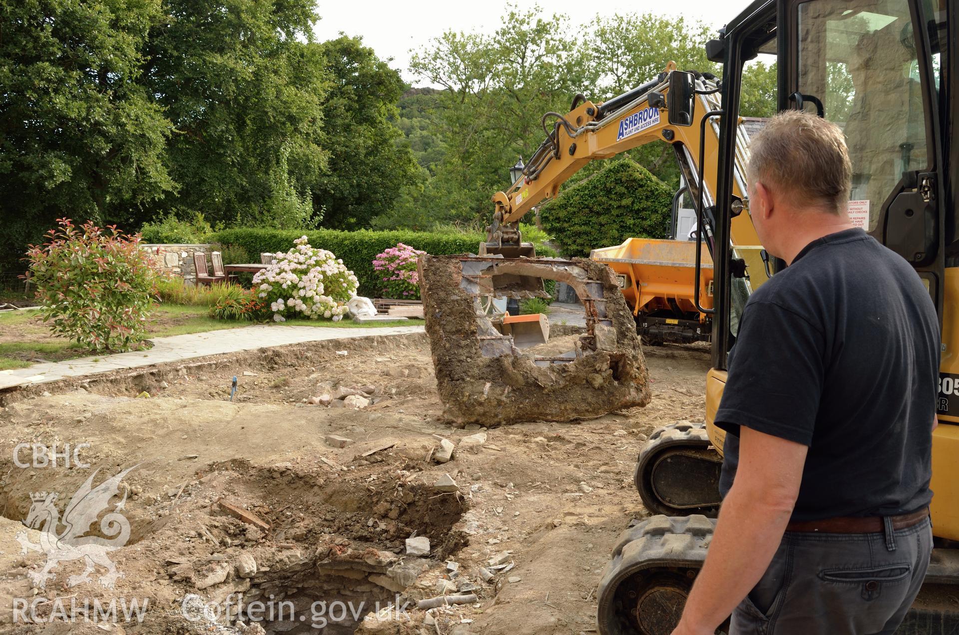 View from the south of the underside of concrete surround of well. Photographed by Gwynedd Archaeological Trust as part of archaeological mitigation report for well at Plas Celynin, Henryd, Conwy, on 6th August 2018. Project no. G2568.