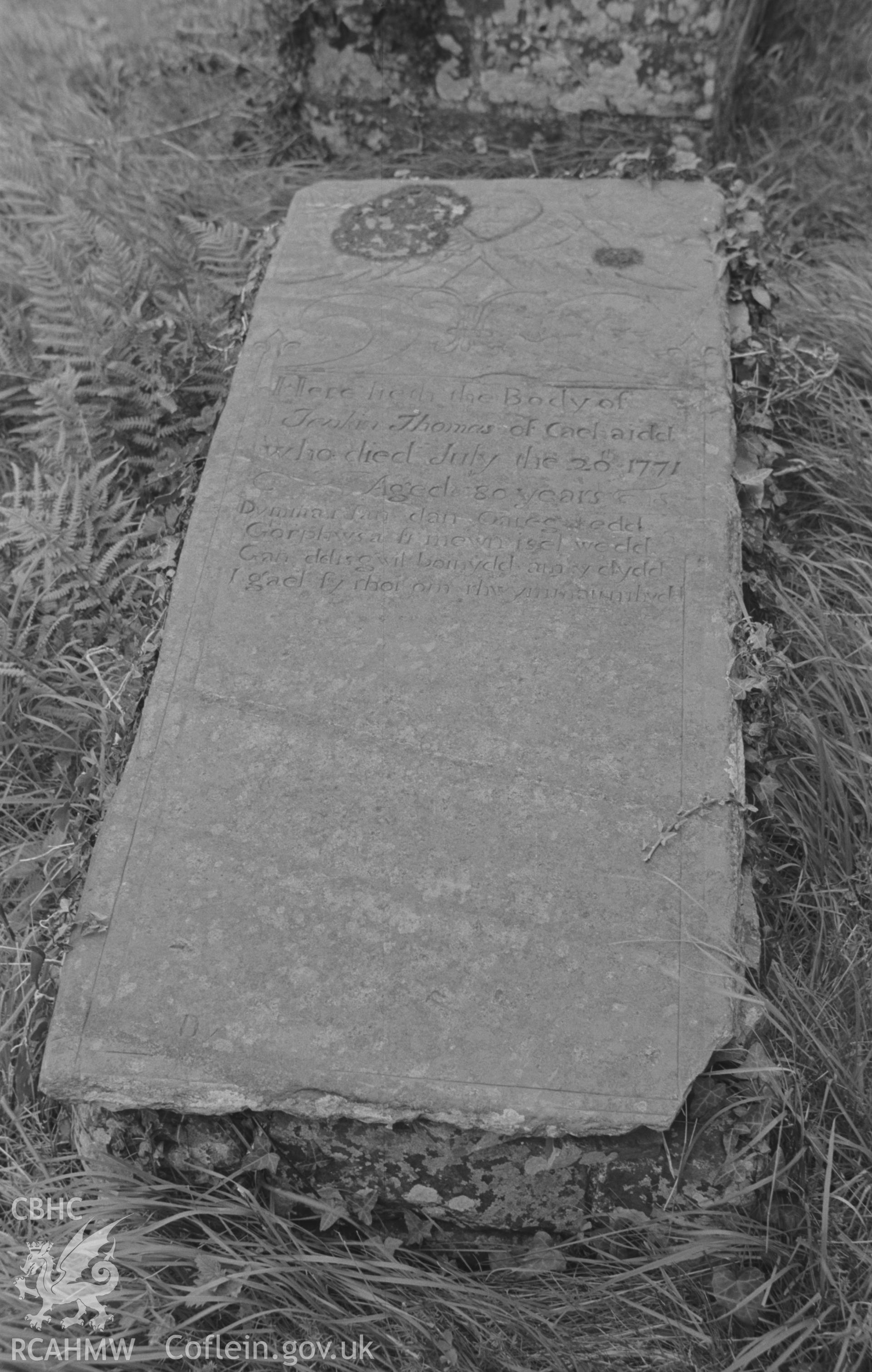 Digital copy of a black and white negative showing 1771 gravestone to the memory of Jenkin Thomas at St. David's Church, Henfynyw, Aberaeron. Photographed by Arthur O. Chater on 5th September 1966 from Grid Reference SN 447 613.