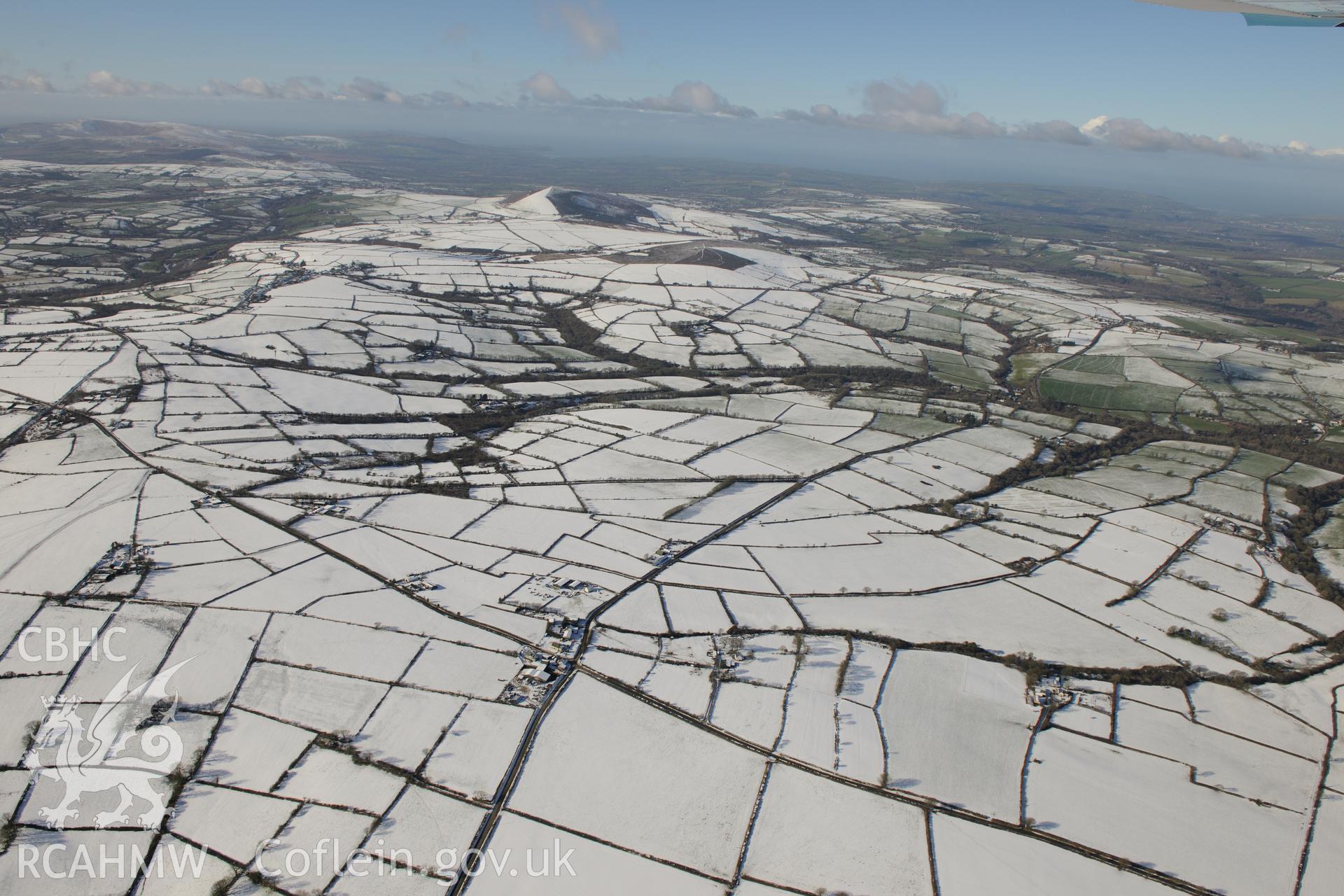 Snow-covered landscape around Cross Inn Farm, about six miles south west of Newcastle Emlyn. Oblique aerial photograph taken during the Royal Commission's programme of archaeological aerial reconnaissance by Toby Driver on 4th February 2015.