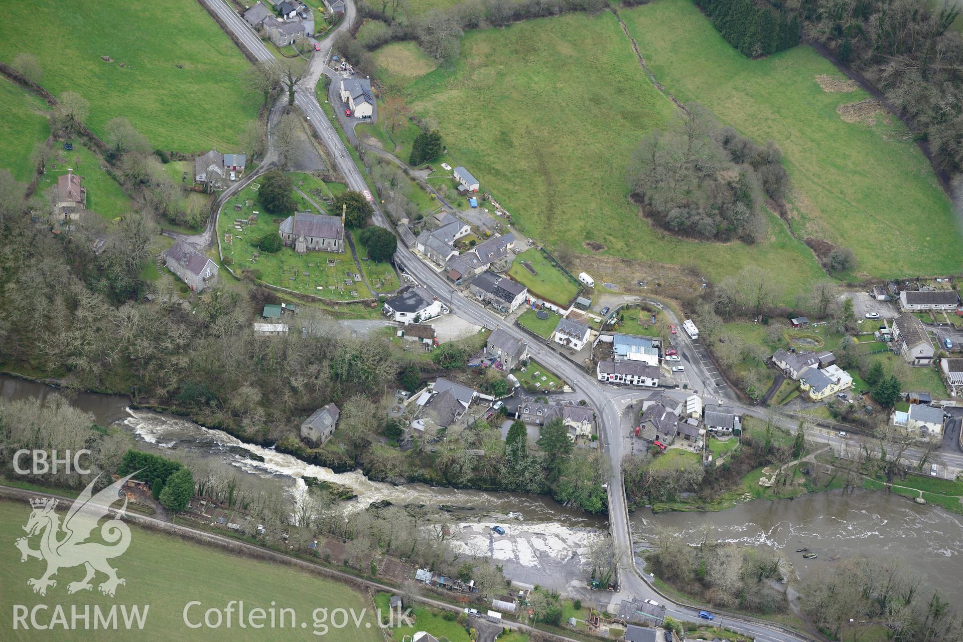 St. Llawddog's church, Parc-y-Dommen motte and Cenarth bridge, Cenarth. Oblique aerial photograph taken during the Royal Commission's programme of archaeological aerial reconnaissance by Toby Driver on 13th March 2015.