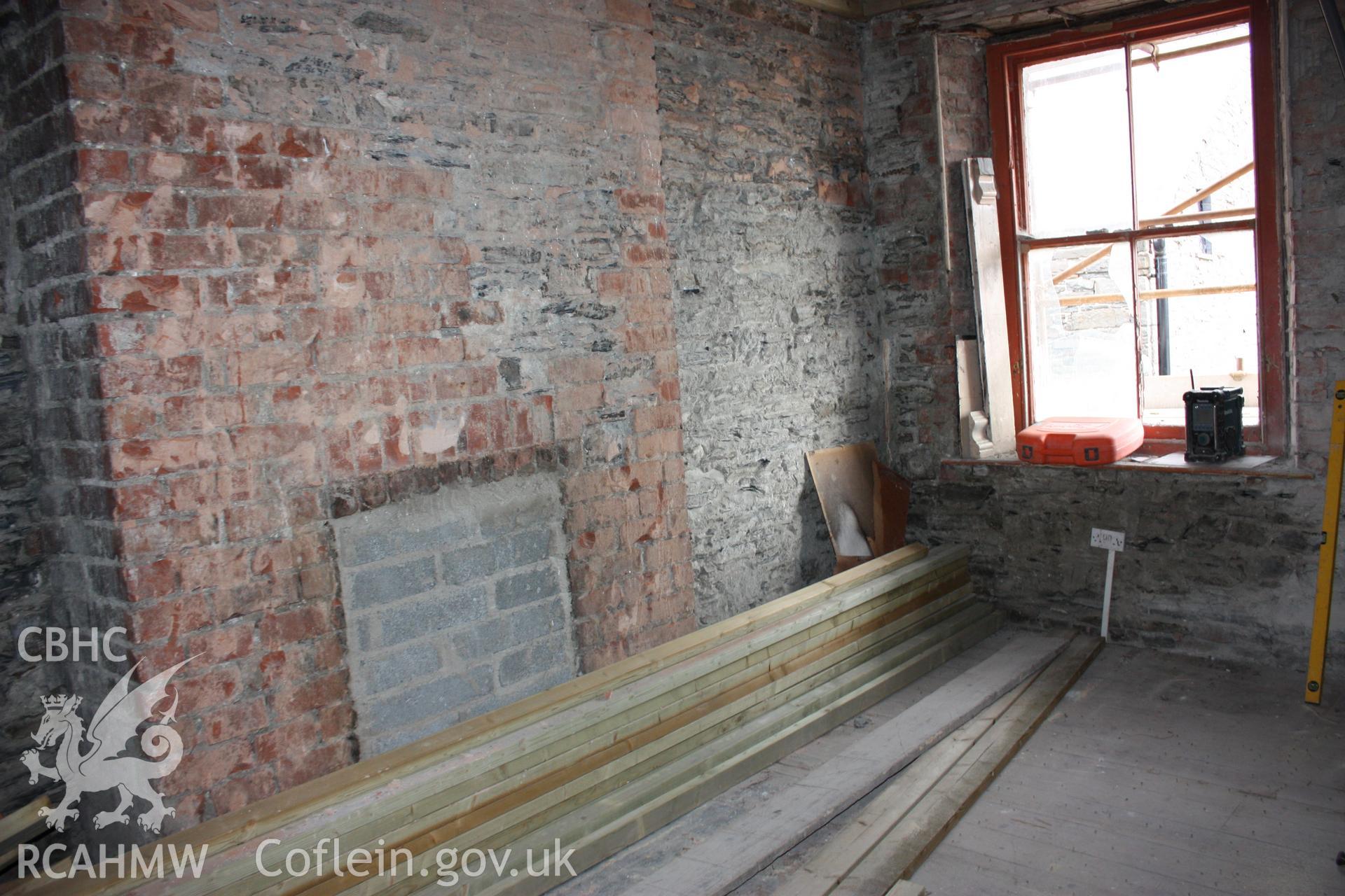 Colour photograph showing interior view of bricked up fireplace at the Old Auction Rooms/ Liberal Club in Aberystwyth. Photographic survey conducted by Geoff Ward on 9th June 2010 during repair work prior to conversion into flats.