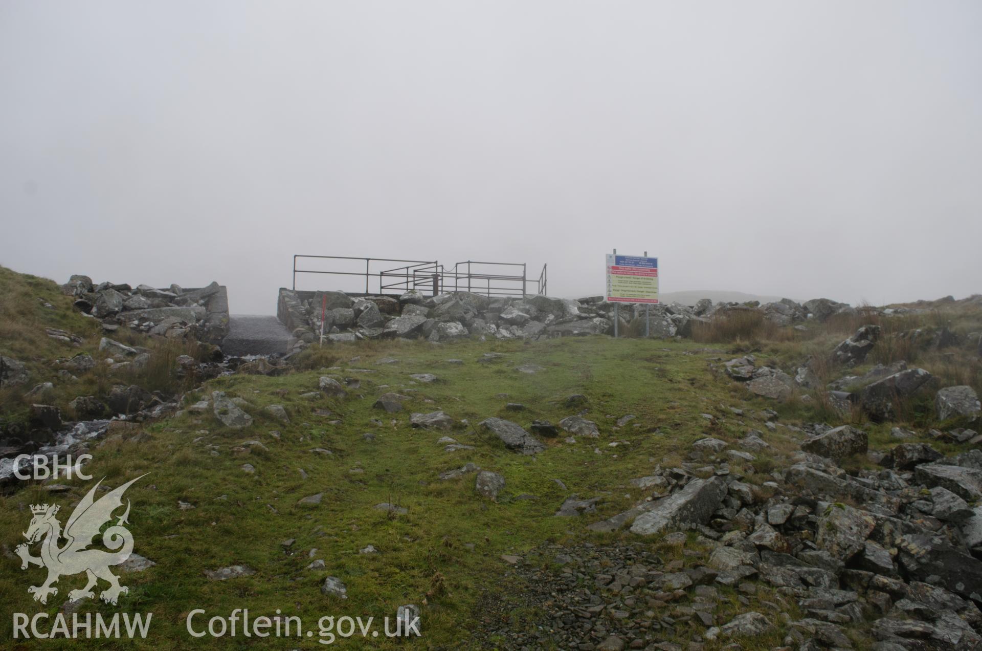 General view from the south south-east of Gelli Gain reservoir dam, Trawsfynydd. Photographed as part of archaeological assessment conducted by Gwynedd Archaeological Trust on 16th October 2018. Project no. 2579.