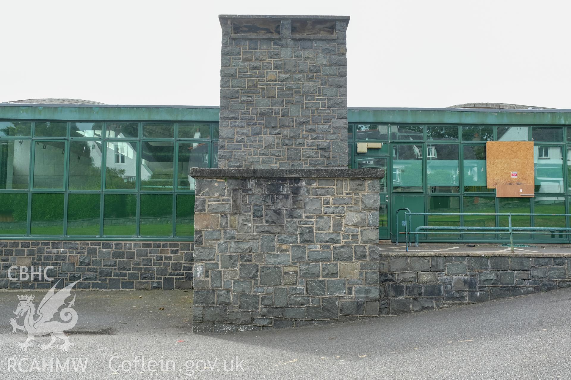 Digital colour photograph showing exterior view of a heavily fenestrated and stone wall at Caernarfonshire Technical College, Bangor. Photographed by Dilys Morgan and donated by Wyn Thomas of Grwp Llandrillo-Menai Further Education College, 2019.