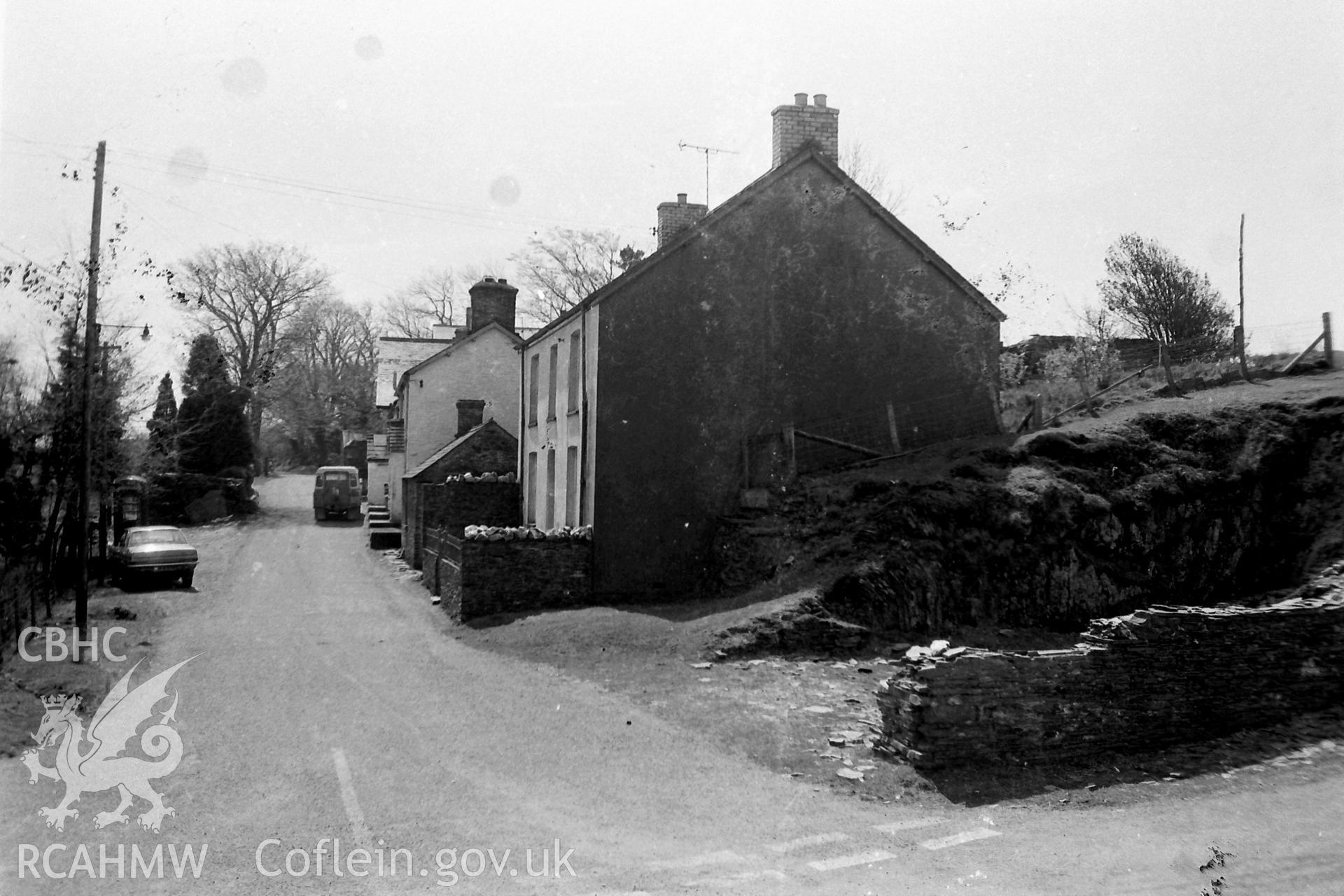 Digitised black & white photograph of housing in the village of Ystumtuen. Produced during a Bachelor of Architecture dissertation entitled: 'The Form and Architecture of Nineteenth Century Industrial Settlements in Rural Wales' by Martin Davies, 1979.