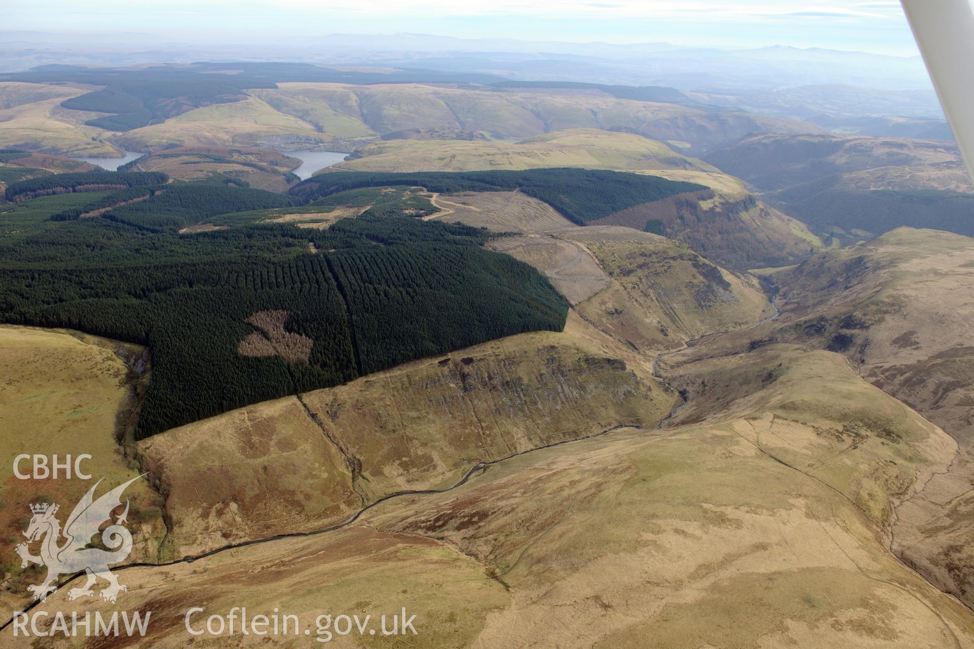 Llyn Brianne reservoir and an unknown deserted rural settlement in the Doethie valley, west of Llanwrtyd Wells. Oblique aerial photograph taken during Royal Commission?s programme of archaeological aerial reconnaissance by Toby Driver, 28th February 2013.