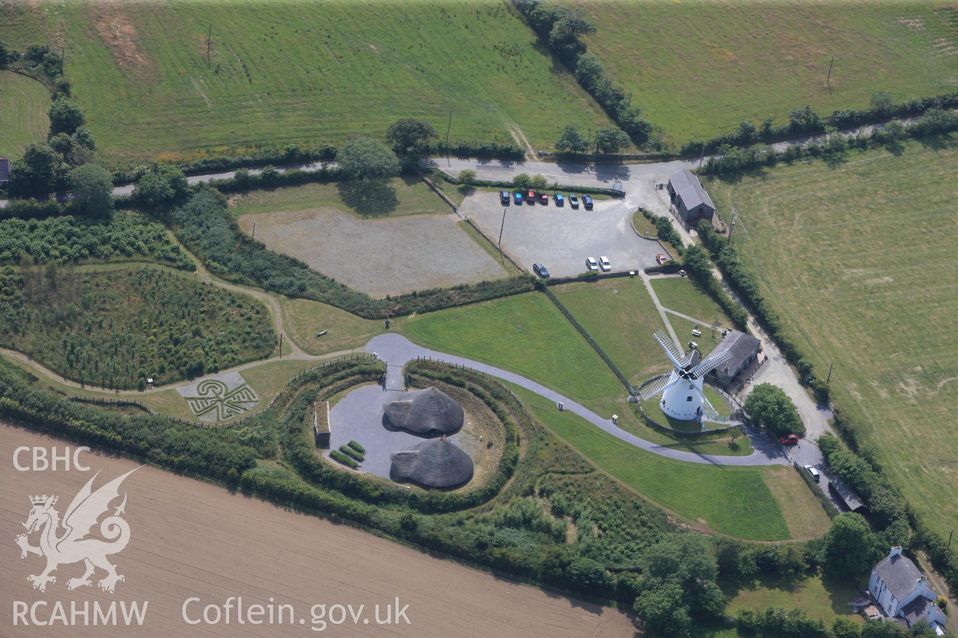Roundhouses at Melin Llynon, Llanddeusant. Oblique aerial photograph taken during the Royal Commission?s programme of archaeological aerial reconnaissance by Toby Driver on 12th July 2013.