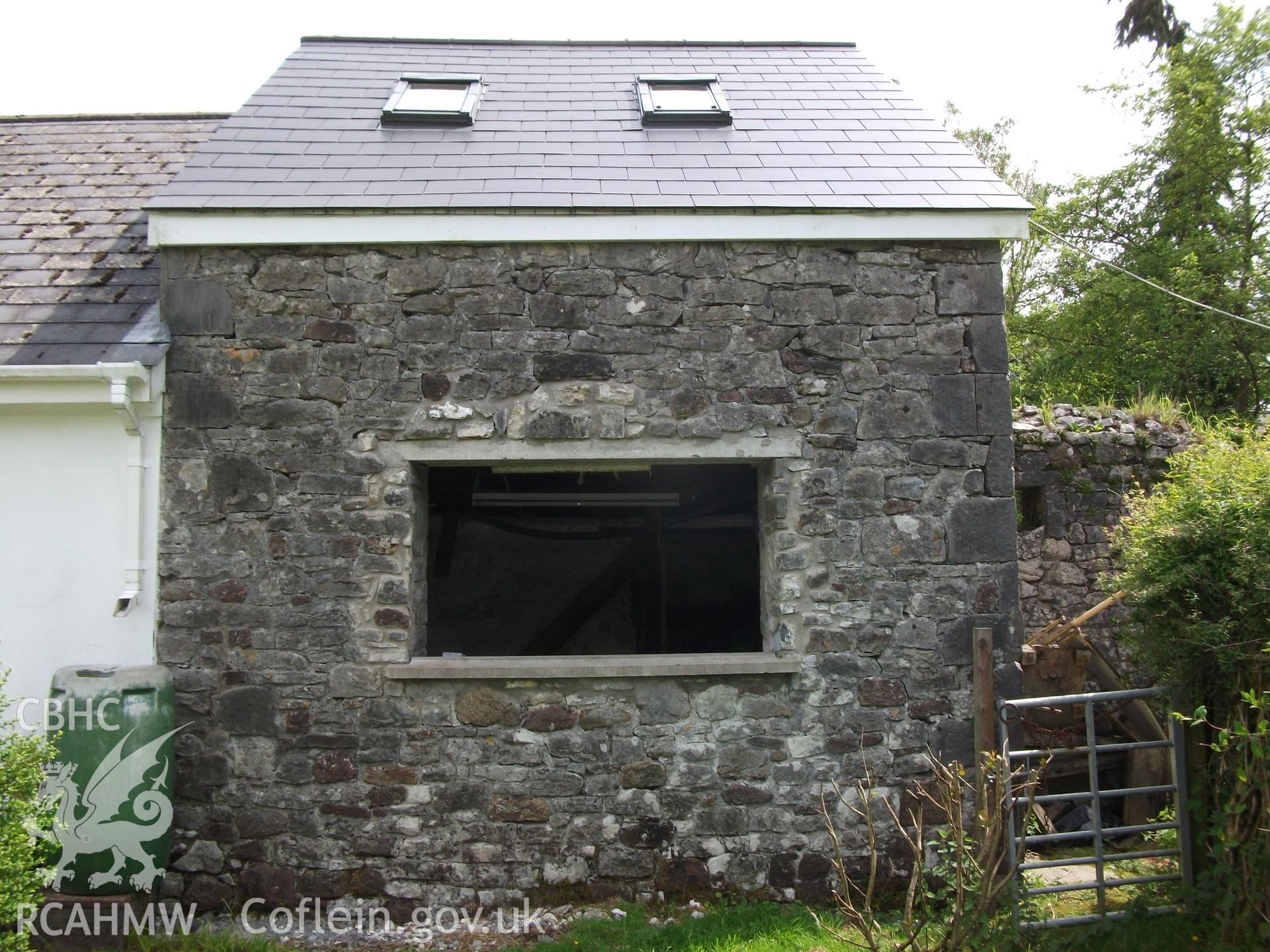 Photograph showing exterior front elevation of the building attached to the cottage at Pant-y-Castell, Maesybont. Photographed by Mark Waghorn to meet a condition attached to planning application.