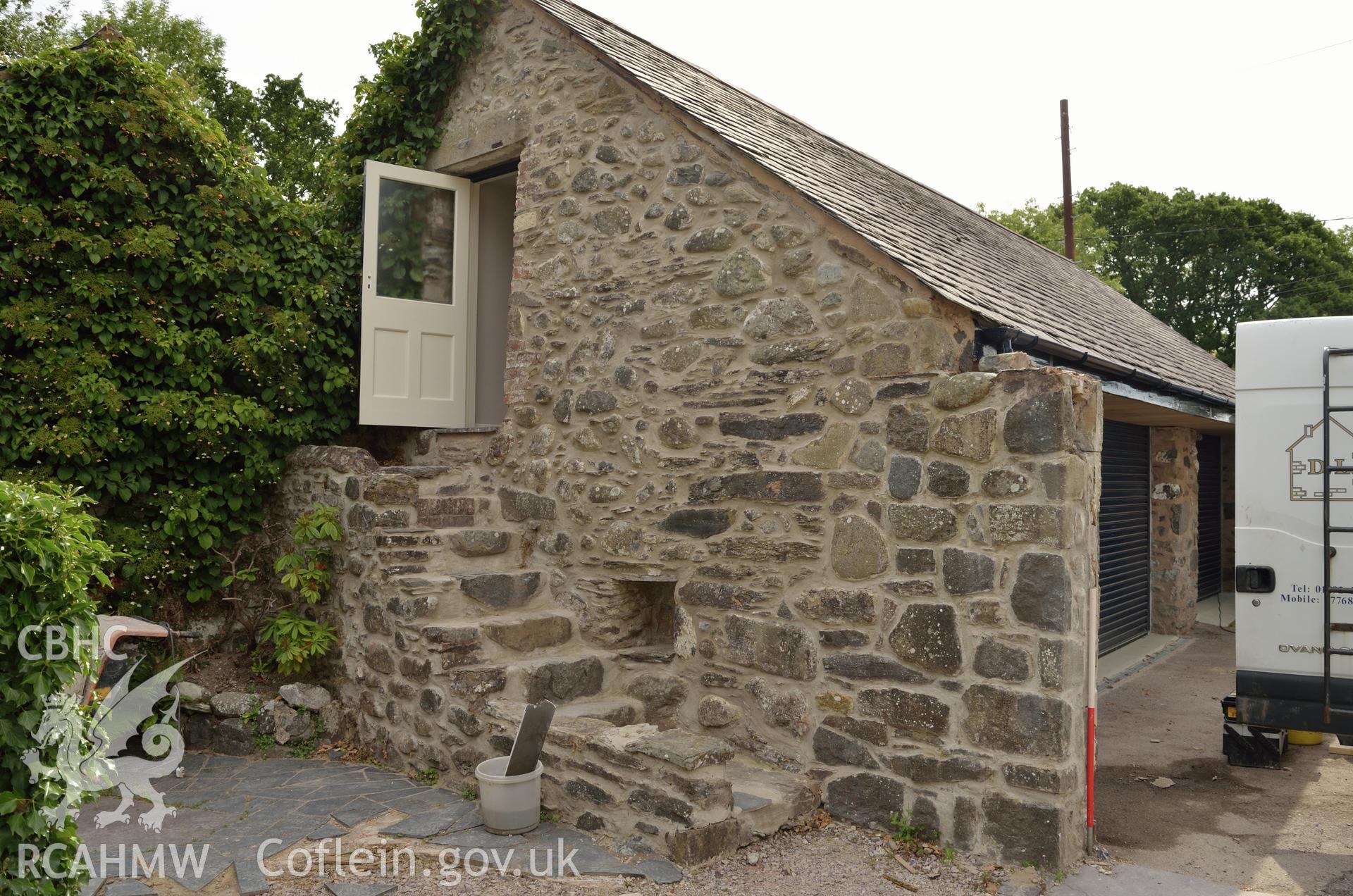 'North face of outbuilding (steps leading to attic), viewed from the north.' Photographed by Gwynedd Archaeological Trust as part of archaeological mitigation report for well at Plas Celynin, Henryd, Conwy, on 6th August 2018. Project no. G2568.